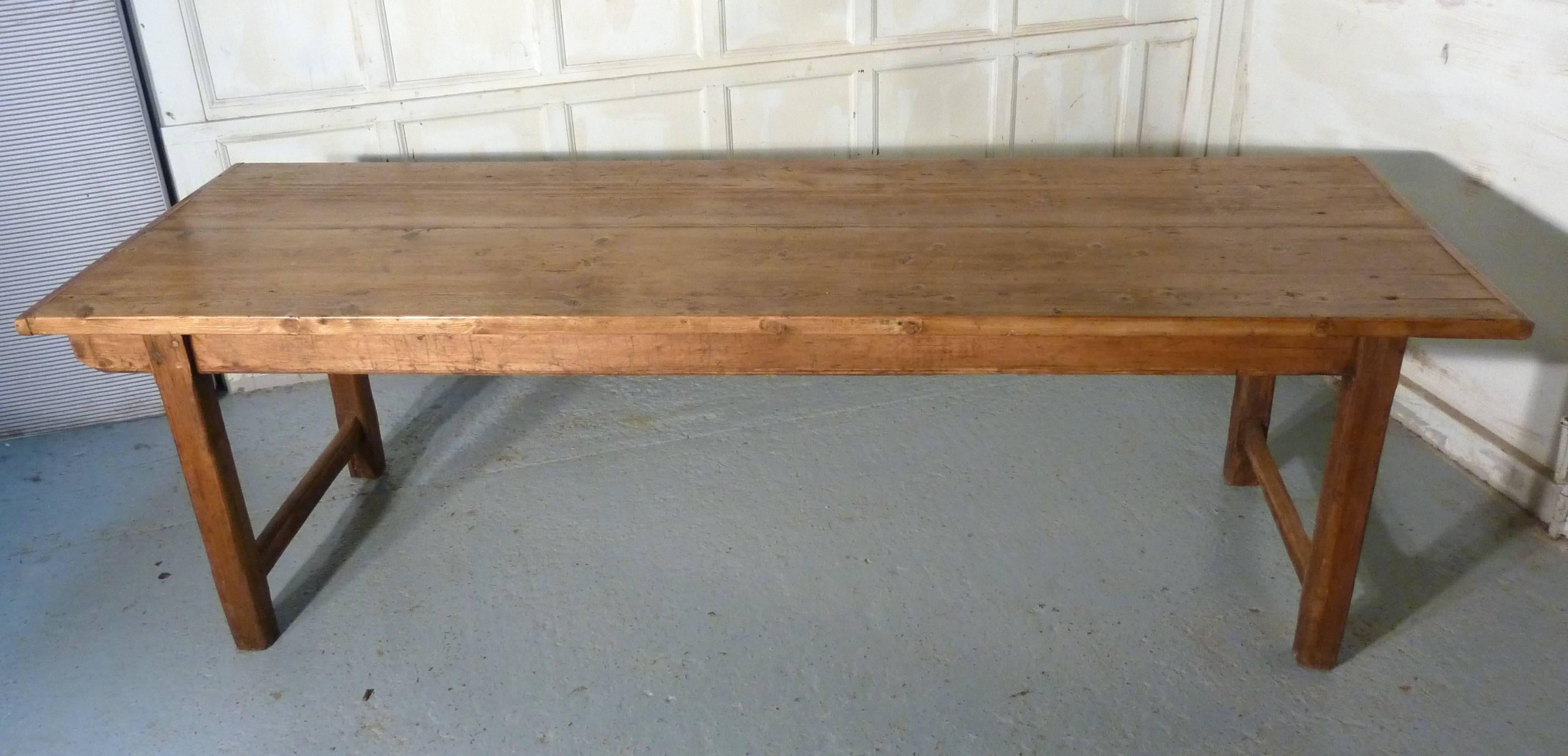 This long farmhouse table dates from circa 1890.
The four plank tabletop is 1” thick with cleated ends, there is plenty of character to be seen on this piece providing you like the Rustic Look.
The tabletop has some old wood worm runs and there