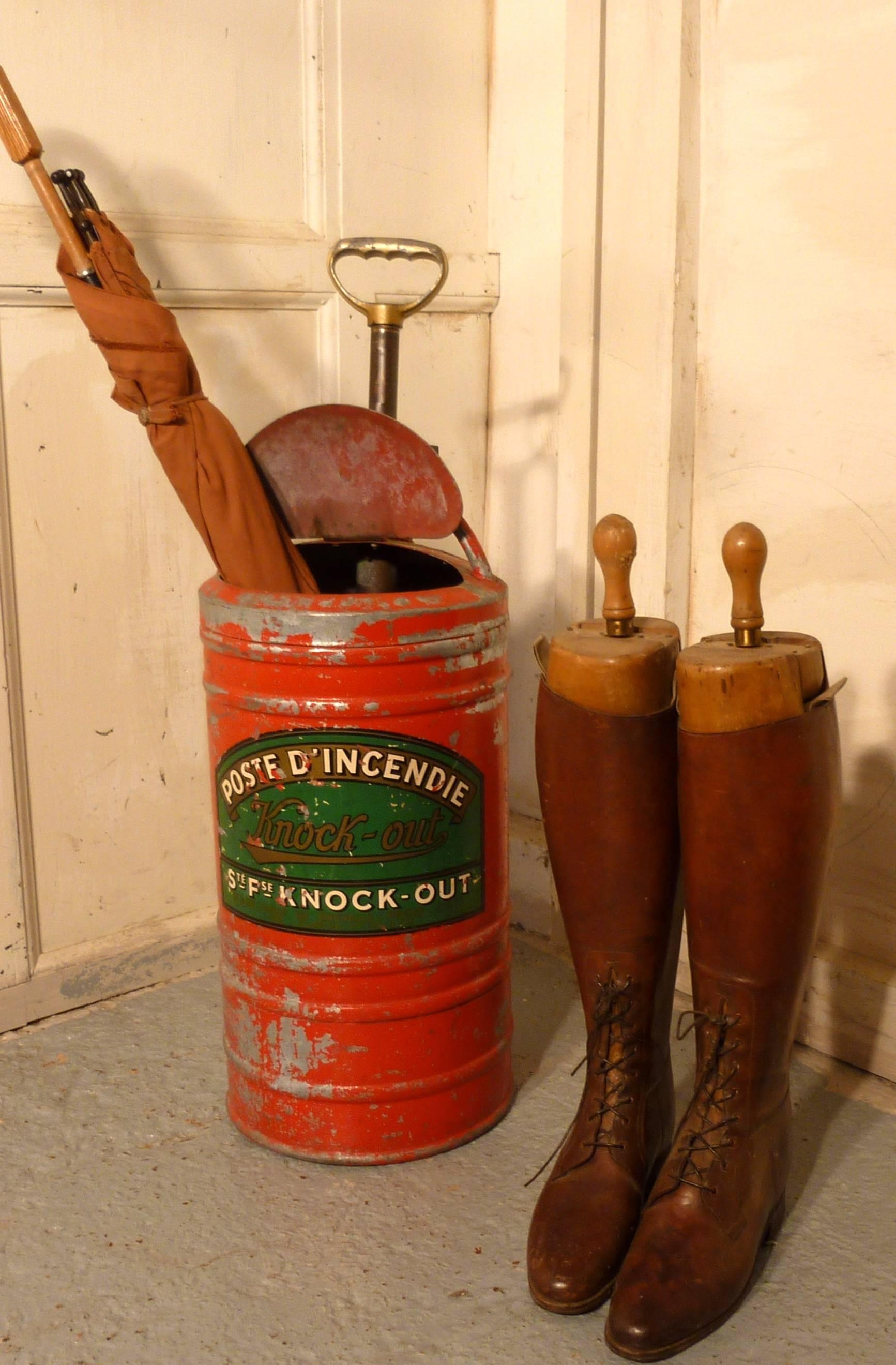 A handsome and quirky thing, in metal, the pump is fixed inside the canister, the lid at the front opens and is a good height for standing walking sticks and umbrellas
The stand is in good sound condition and the slightly chipped paint is bright