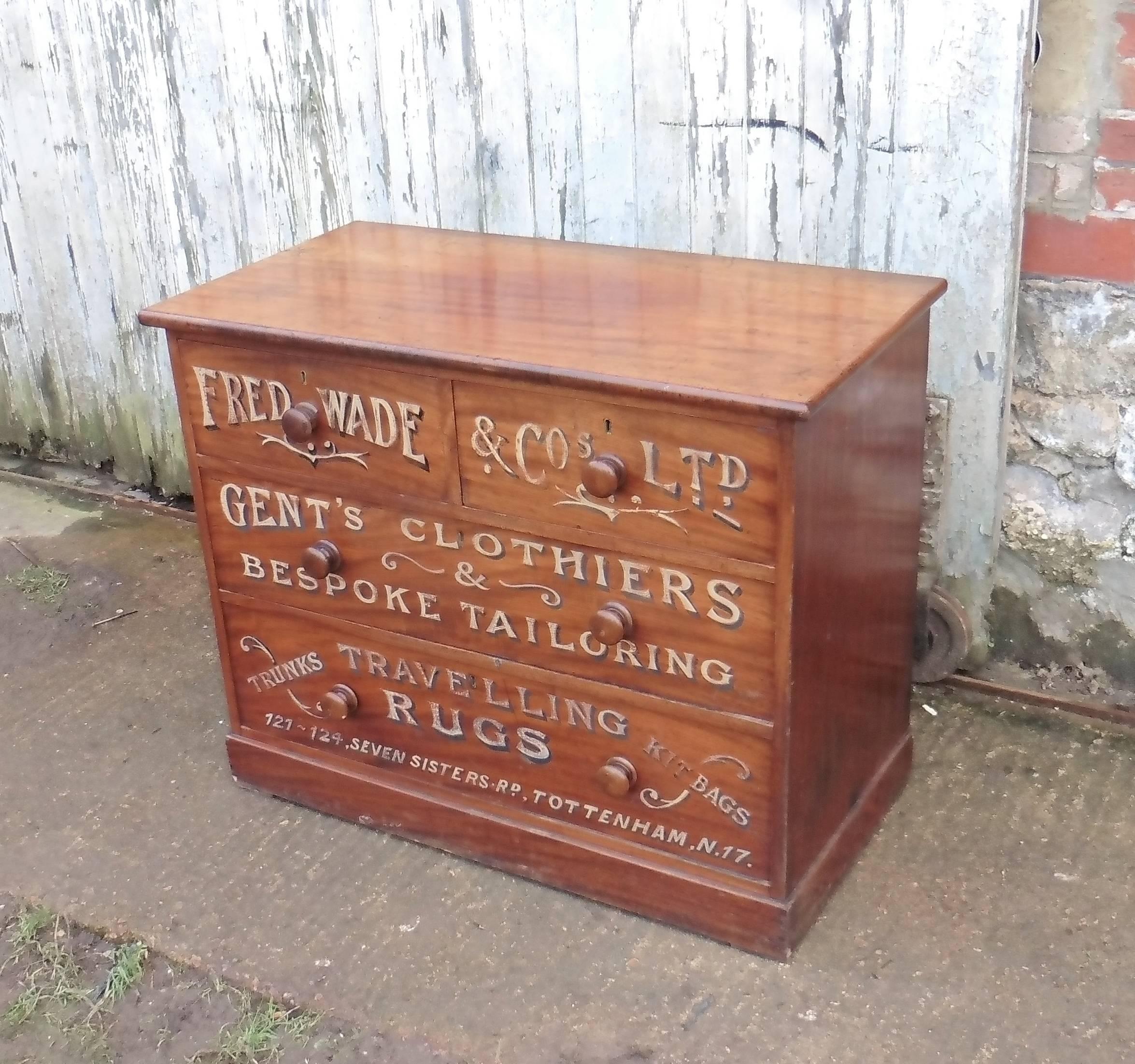 This is a small chest of drawers painted with advertisements from Fred Wade Gentlemans Outfitter, the chest of drawers is made in mahogany and has gold and shadowed Lettering painted on the front, we also have larger chest of drawers from the same