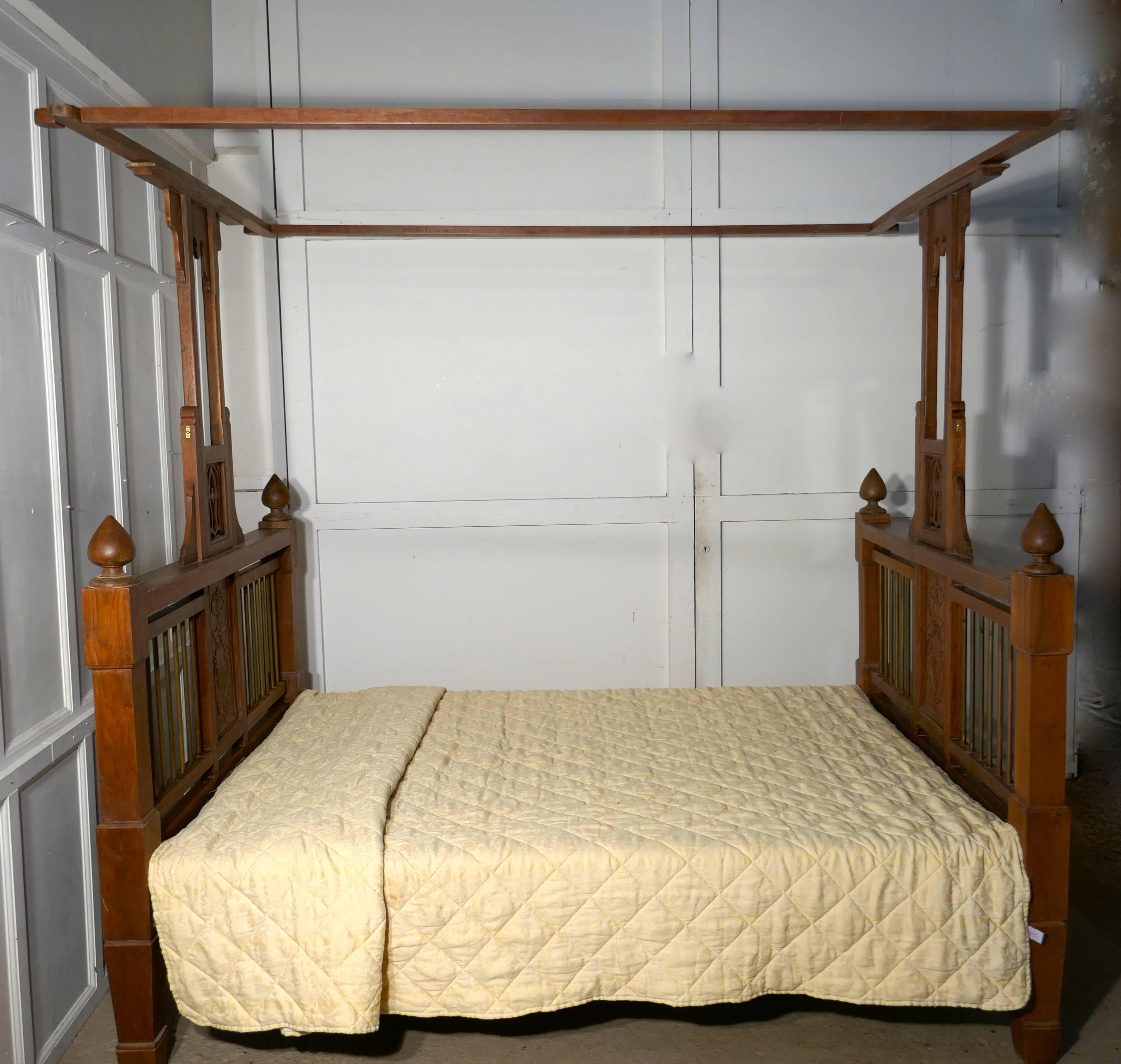 This is a very unusual bed it has slightly square lines with pierced decorated central post leading up from the centre supporting the wide over bed canopy
The bed head and foot have chunky brass rails enclosed in the heavy bed frame and they have