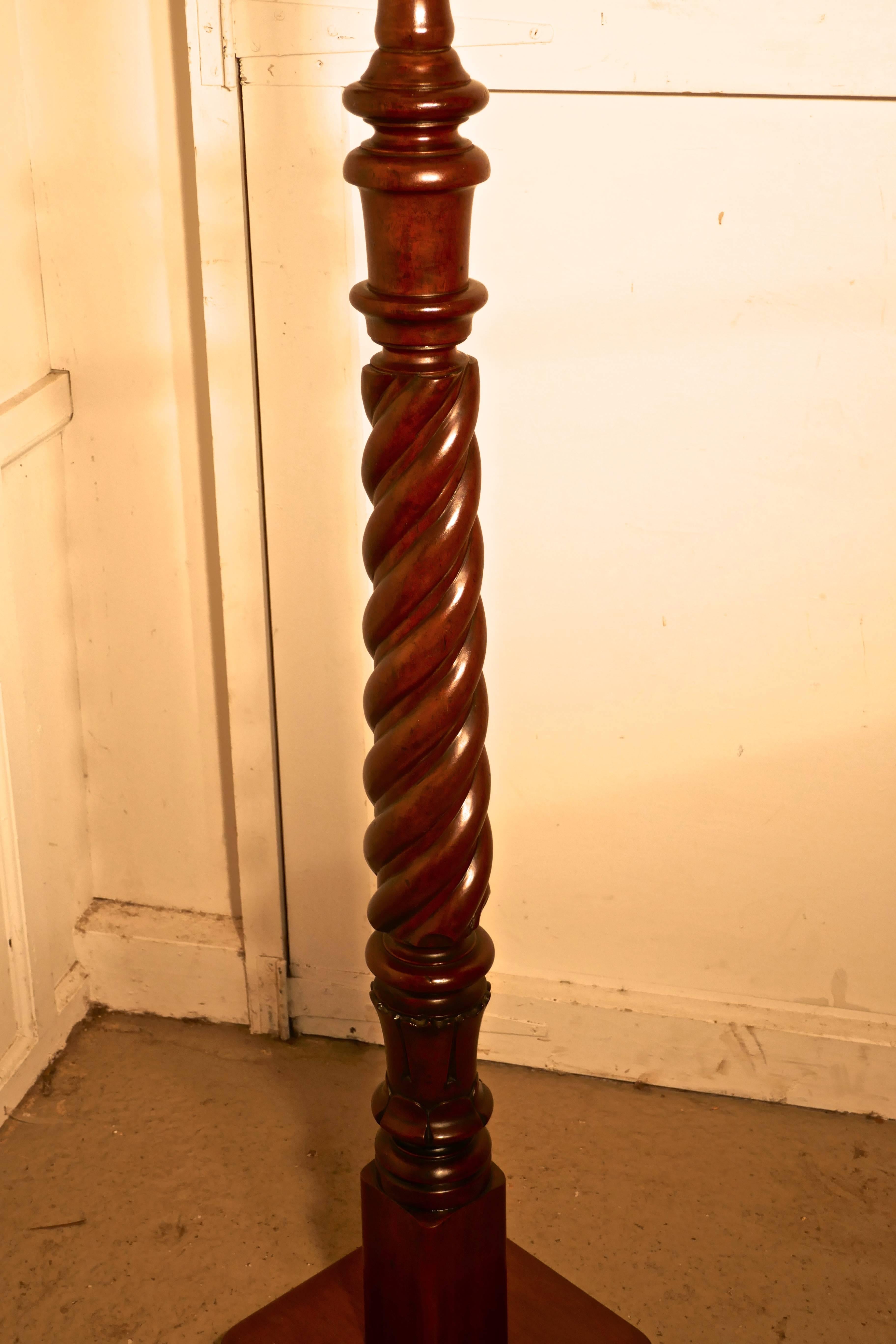 This is an attractive piece in polished mahogany, the lamp stands on a wooden base, the upright is in the form of a very thick barley twist turned column and it is in good condition, the wiring seems to be new but should be checked when installed