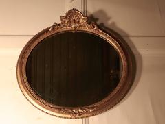 Rare Pair of 19th Century Regency Style Oval Gilt Mirrors