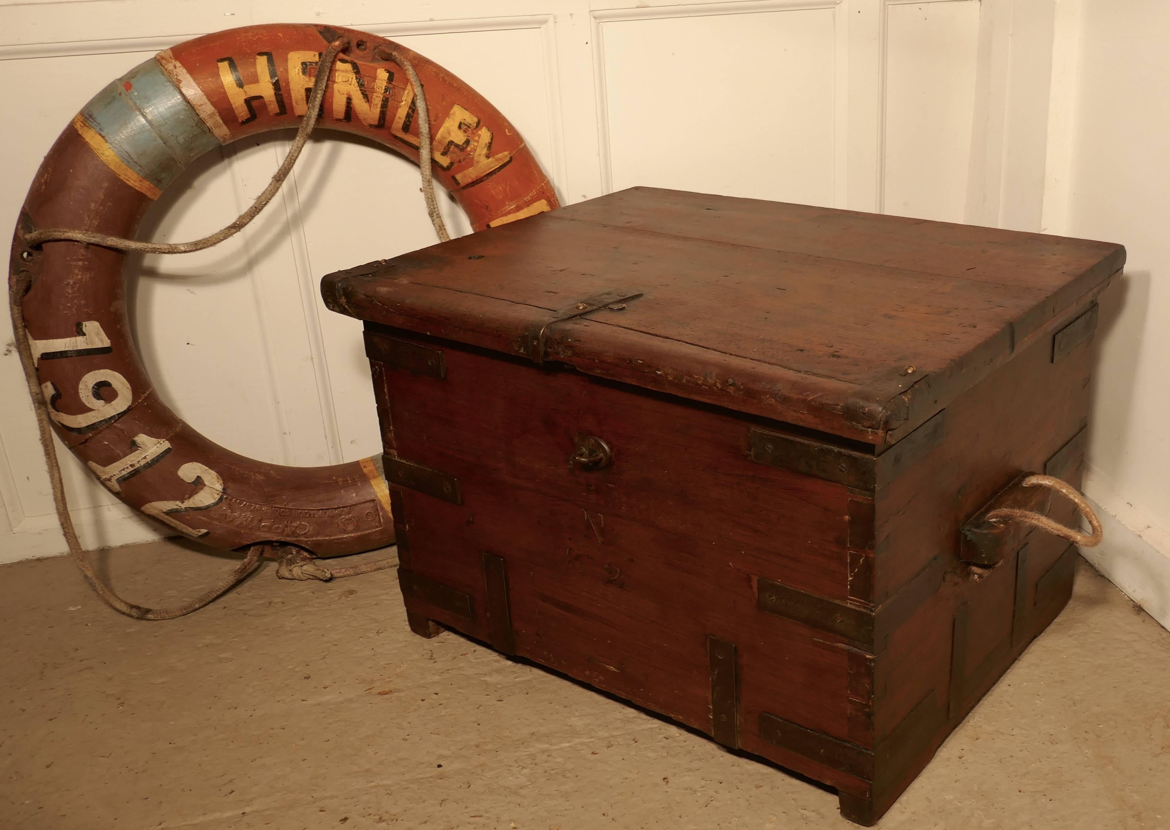 This a heavy quality box, it has heavy iron banding on the outside, and rope carrying handles 
The interior of the box has an open candle box, the front of the box is carved with n and the numbers 3 and 2
This is a piece is very sturdily made, it