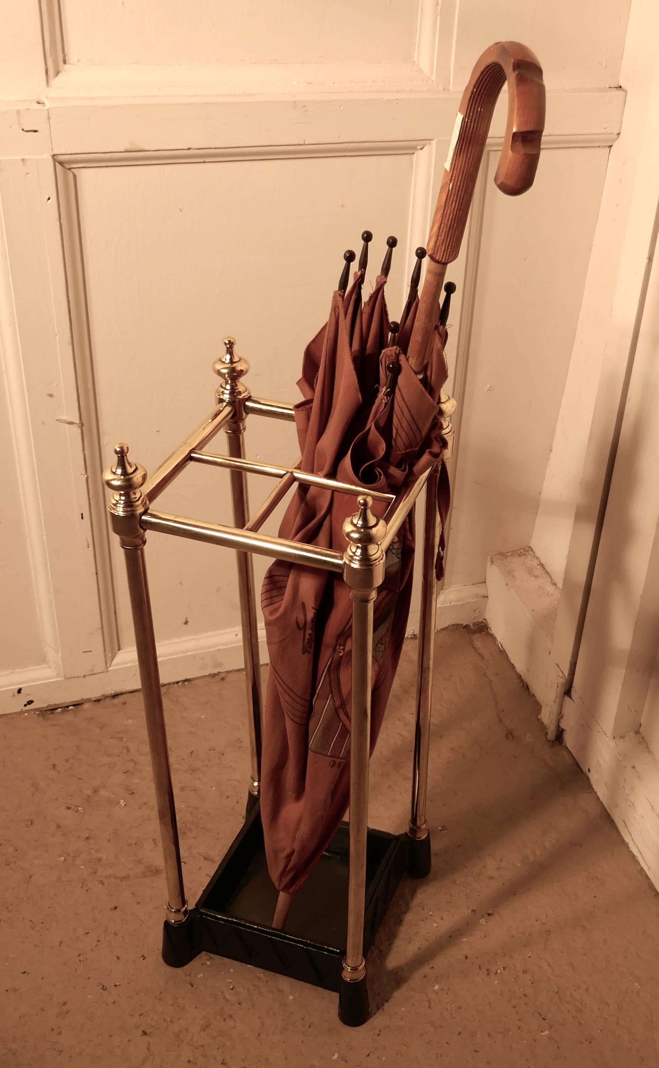 A charming piece, the stand has a brass top divided into four sections to hold either walking sticks or umbrellas, the heavy iron base is also the drip tray and can be removed for cleaning.
The stand is 25” high, 9” square
RB101.
 