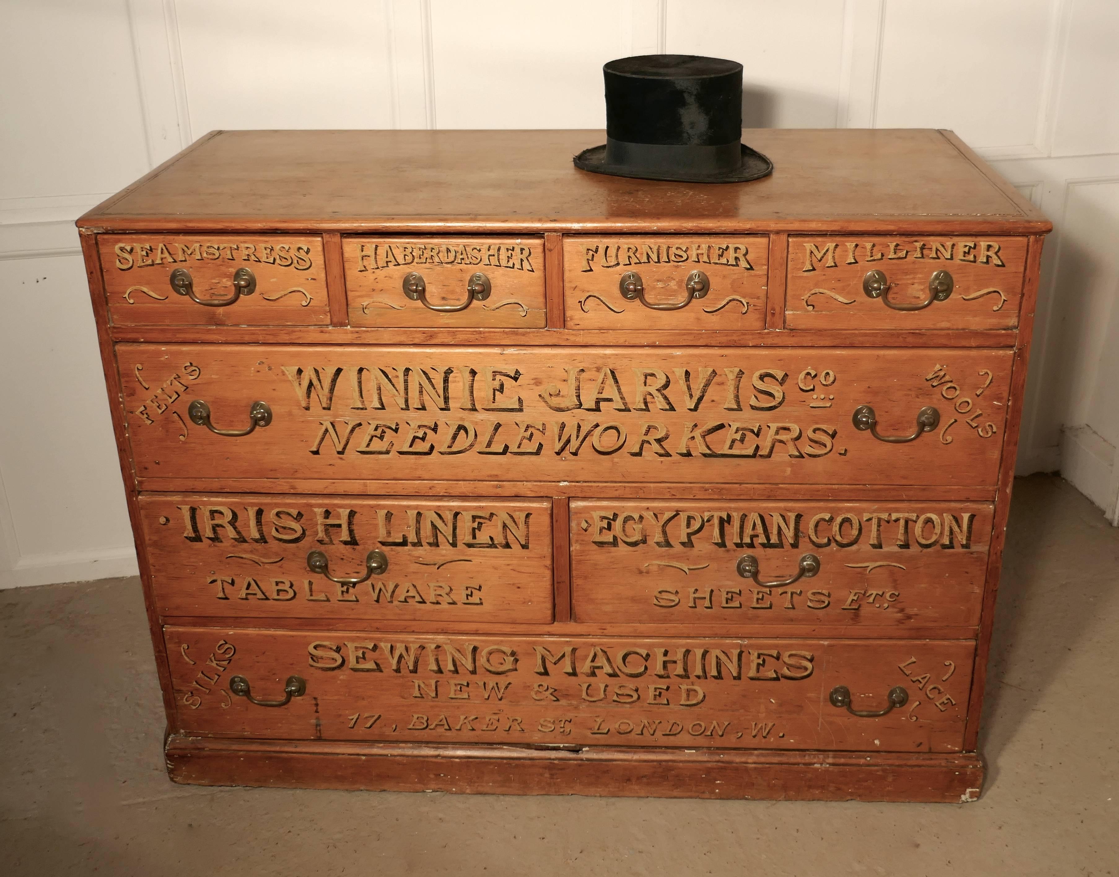This is a large chest of drawers, it has an unusual combination of eight drawers, of varying sizes , the drawers have original brass swan neck handles and the fronts have various words indicating the work carried out and the commodities
