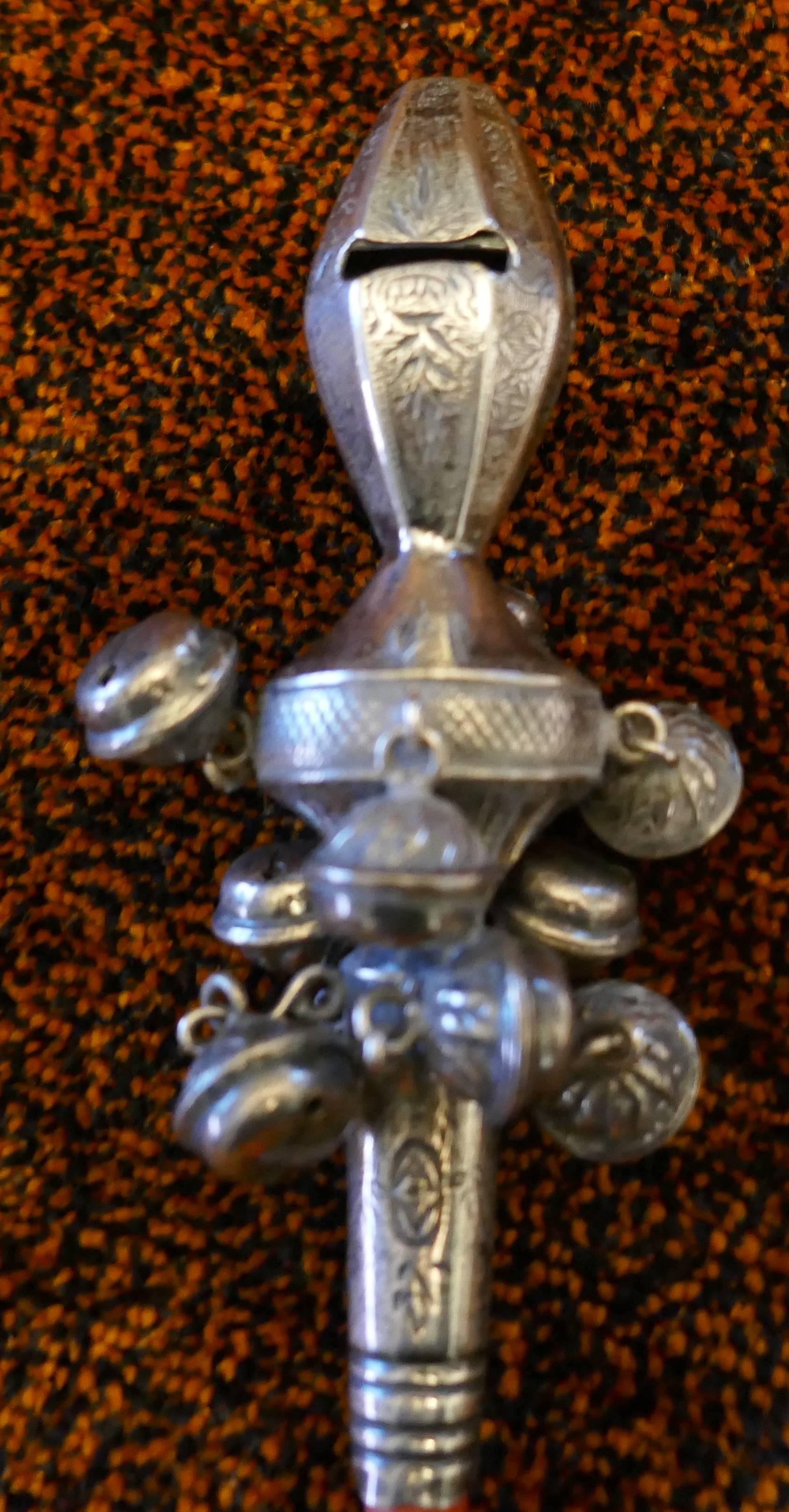 silver baby rattle with bells