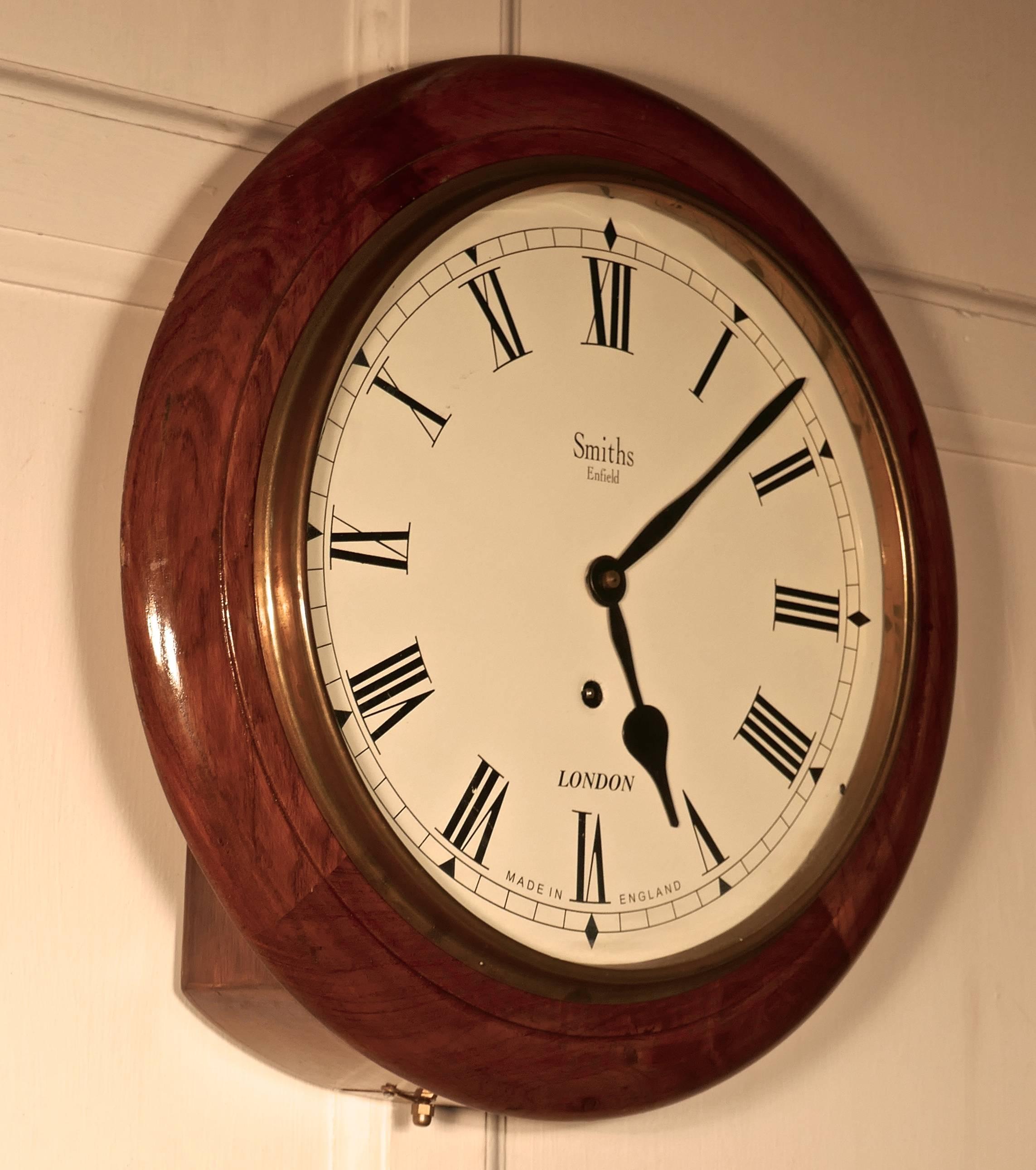 This is a stunning example of an English Traditional School or Railway Clock. Made circa 1910 By Smiths Enfield in London. It has undergone a full service and overhaul so it works as well as the day it was made.
The clock has a painted dial, the