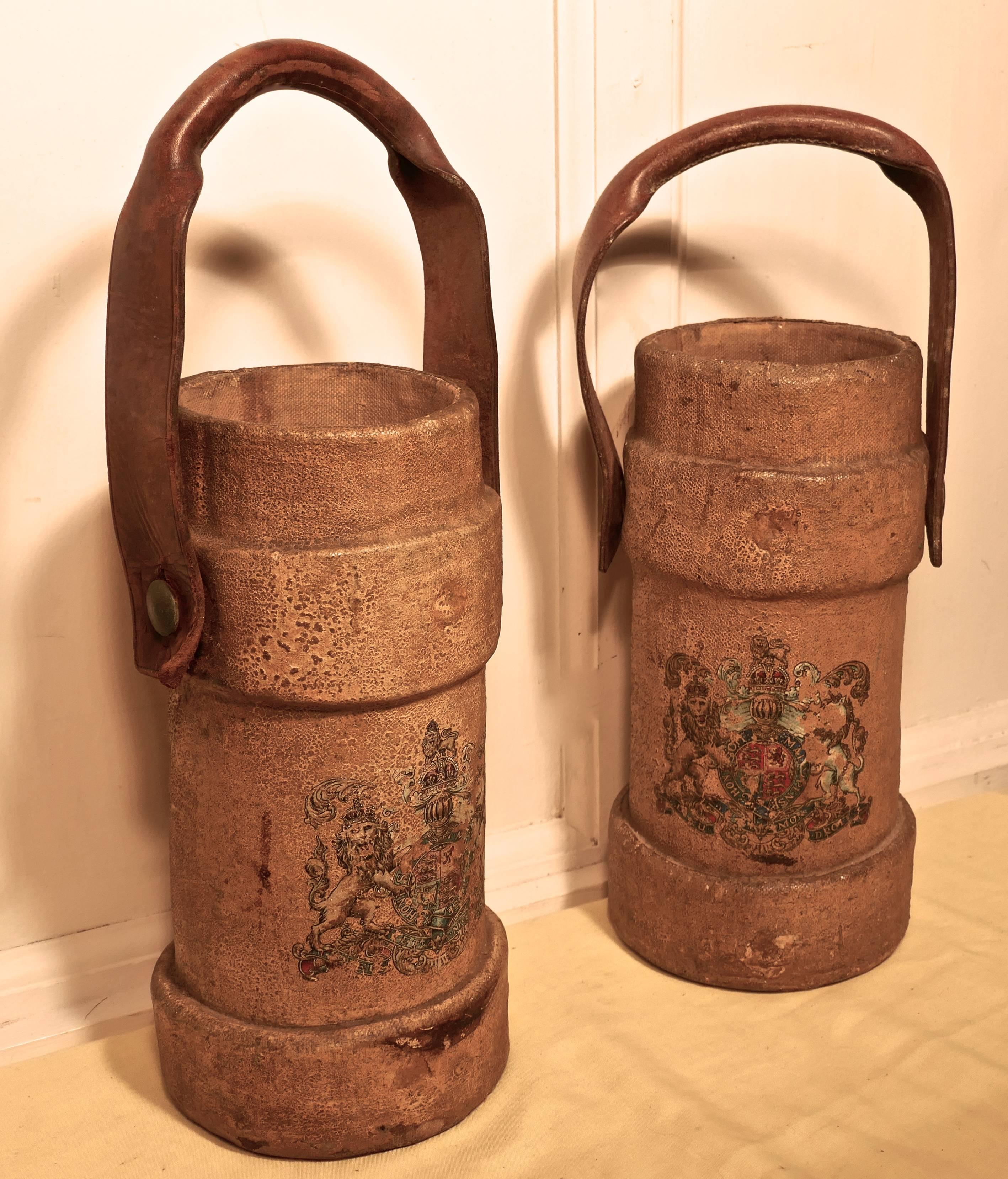 British army canvas artillery shell carriers, or quirky stick stands 

This is a pair of saddler made canvas artillery shell carriers they have two reinforced bands, leather handles and hand-painted gilt and polychrome Royal coat of arms

These