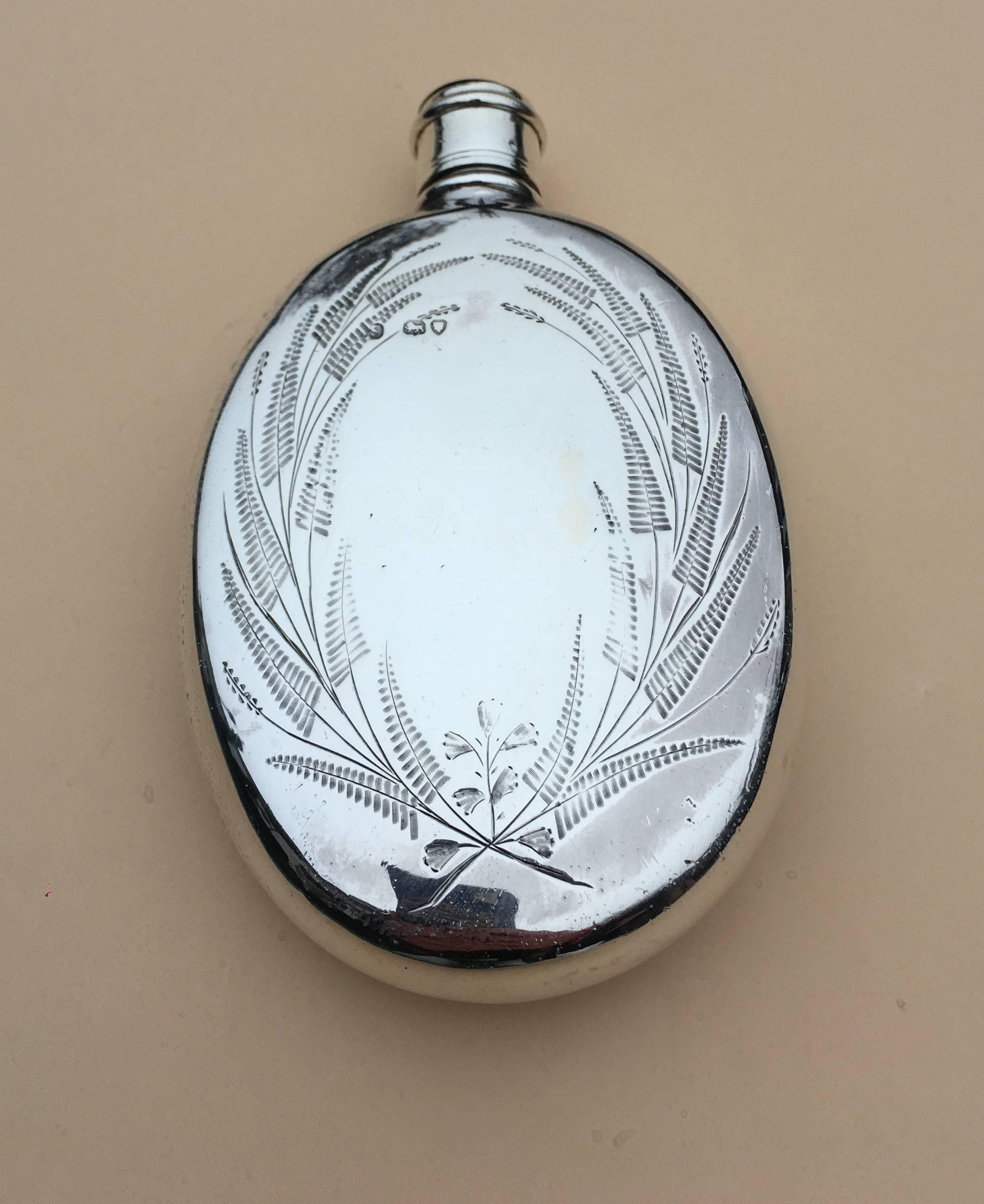 Arts and Crafts Aesthetic Movement silver hip or pocket flask, 1871

A charming piece the flask has an Oval shape, making it ideal to keep in either a breast or hip pocket, 0r dare I say handbag, both sides of the flask are engraved with stylized