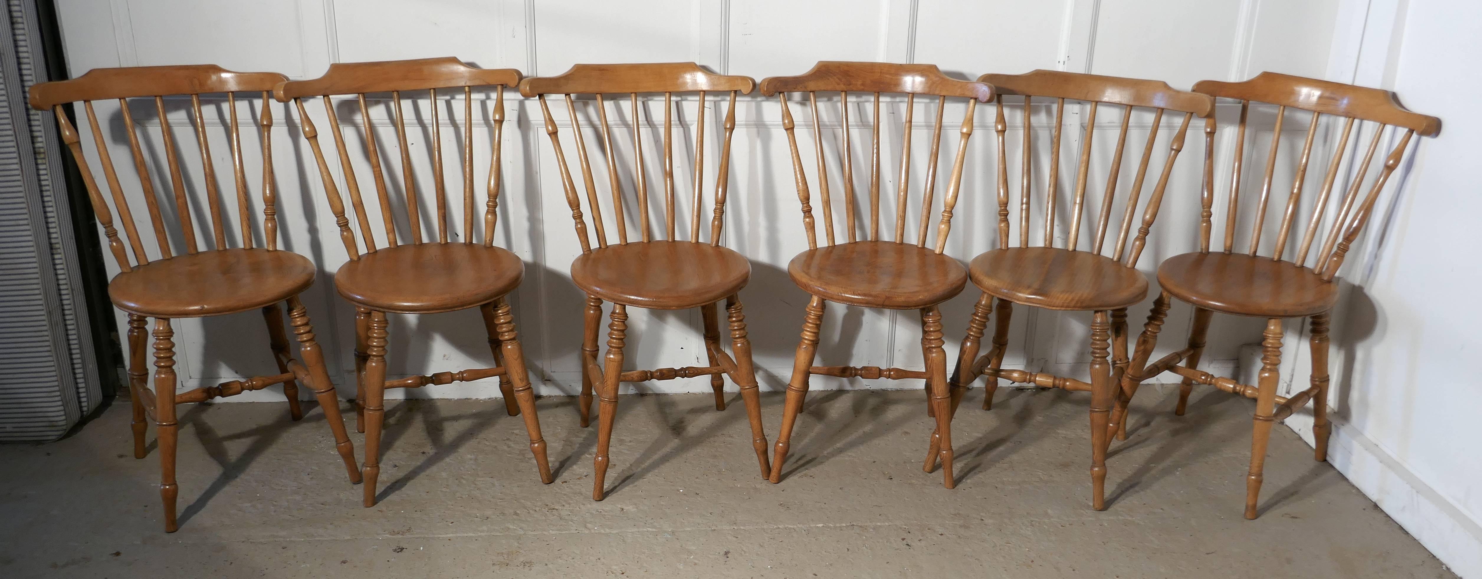 Set of six beech and ash country kitchen dining chairs

The chairs date from the late 19th century, they are a Classic spindle back design, with thick round ash seats, they are very sturdy chairs and very sound, the joints are all good, there is