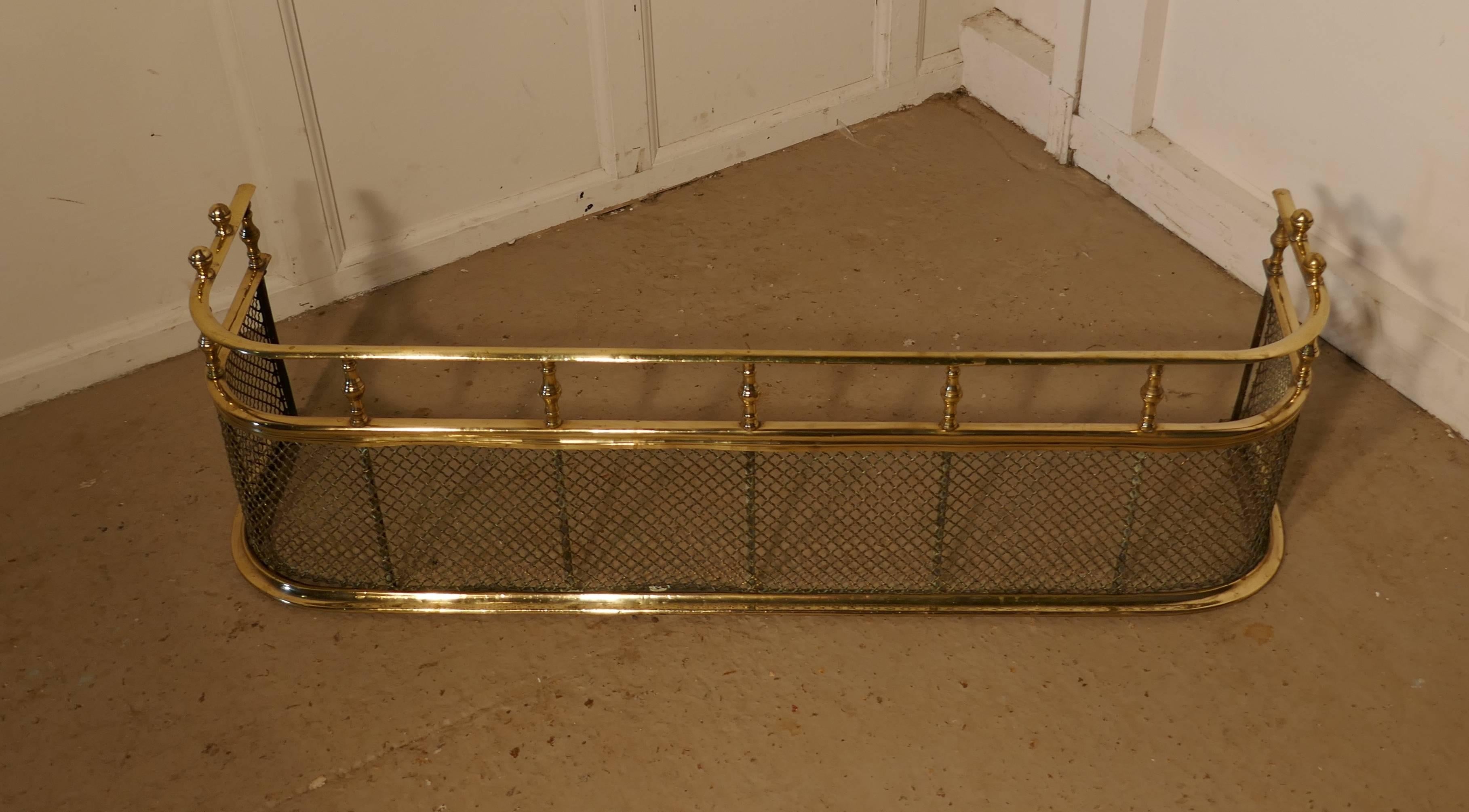 This is an Georgian antique Fender often known as a nursery guard as it completely surrounds the fire.
This Fender is top quality and very heavy it is made in solid brass, even the mesh around the fender is in brass, it has a double rail separated