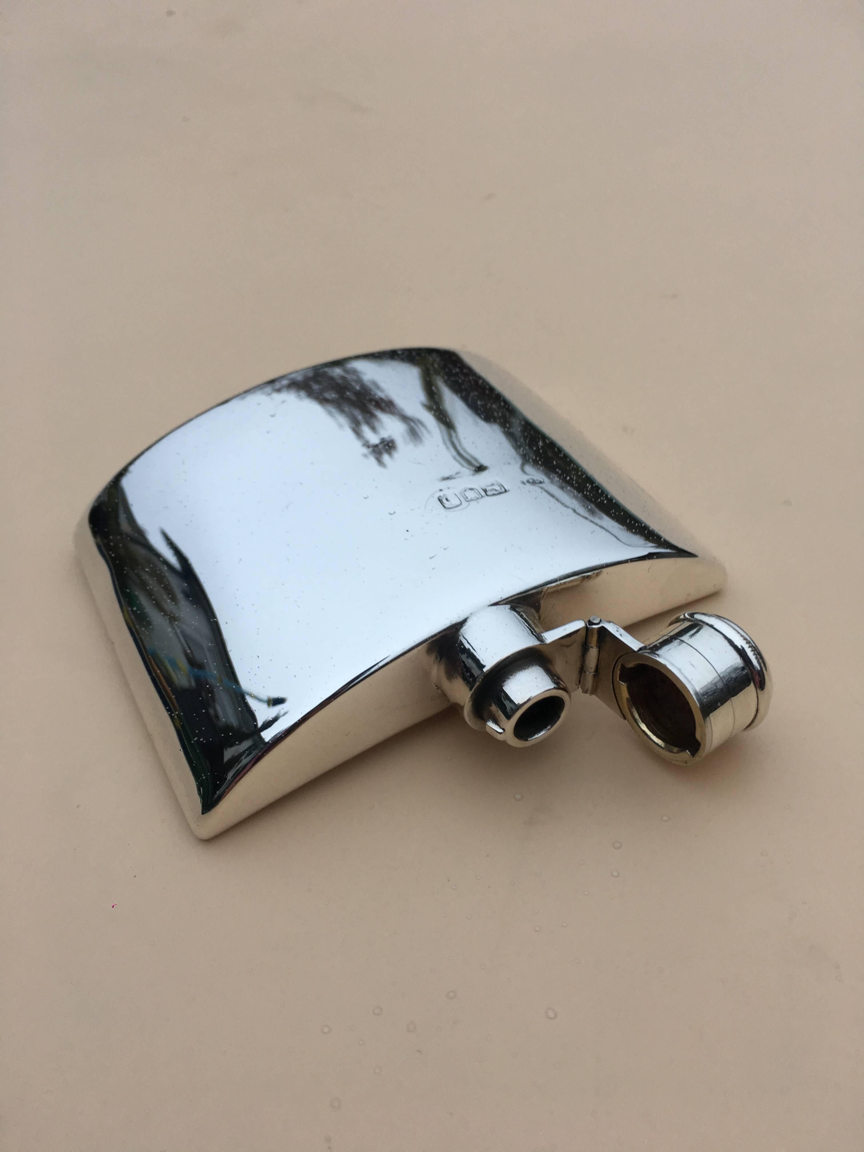 Victorian silver hip flask by Charles Fox & Co Ltd date 1897.

This small hip flask has a lovely curve to one side making it a very neat fit in any pocket, the flask has a hinged lid with turning grip. The flask is made by “ Charles Fox & Co