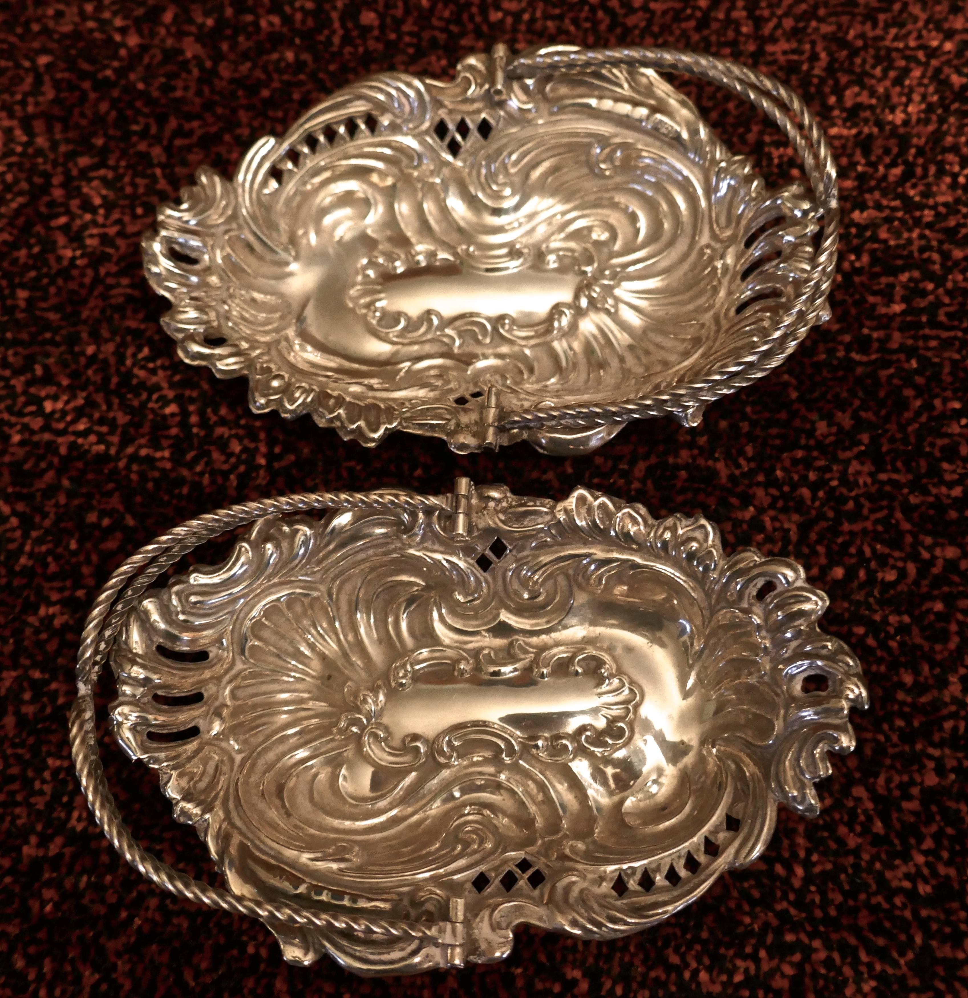 Beautifully cast with a pierced acanthus decoration, each with a double rope twist articulated handle
The baskets are in excellent condition, crisp decoration with no dents or damage
or damage.
A lovely example of High Victorian Style
Weight 70