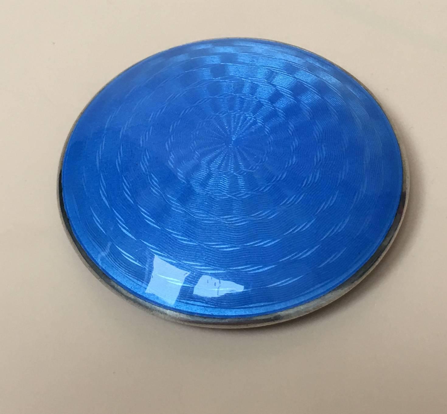 Charming German sterling silver Guilloche Enamel compact case

This delightful piece is enamelled in vivid sky blue, in the centre there is a hand-painted enamel of a romantic pastoral scene, it has no doubt been copied from one of Angelica