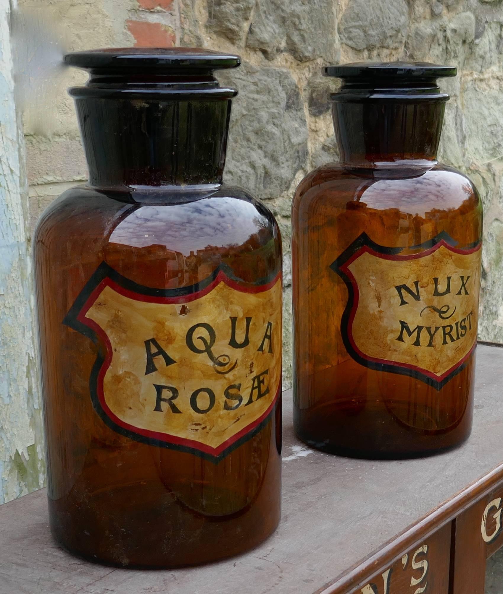 These very attractive jars they date from, circa 1900, one has Aqua Rosæ written on it, the other has Nux Myrist, the writing is set on gold in a shield shape
The Jars are in very good condition, they have minor chipping to the interior of the