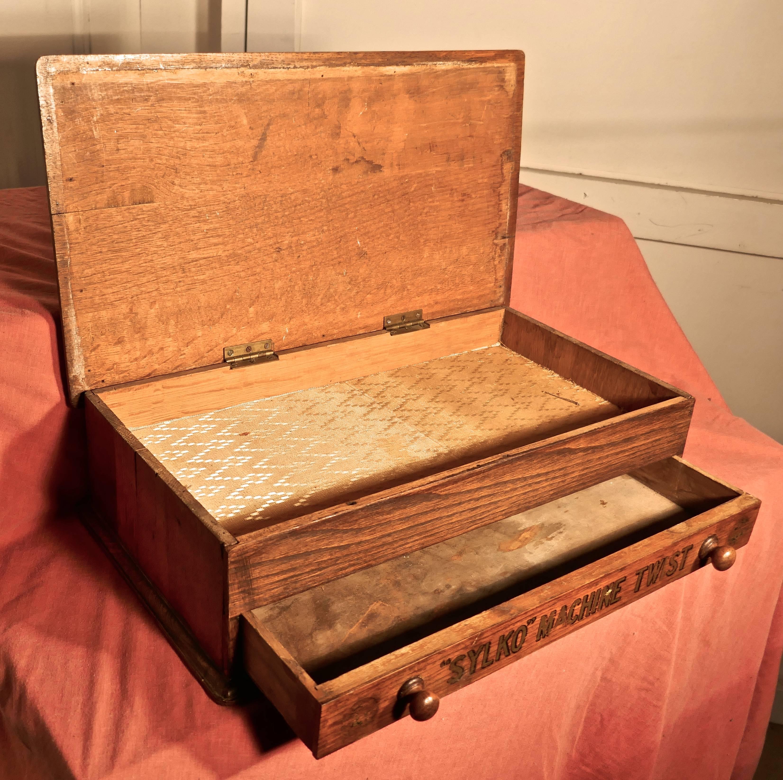 Dewhurst’s Sylko machine cotton reel box Haberdashery shop display

This is a pretty piece, formerly in everyday use in a Haberdashers shop, the lid of little wooden cabinet opens and it has a drawer beneath, some of the advertisements are rather