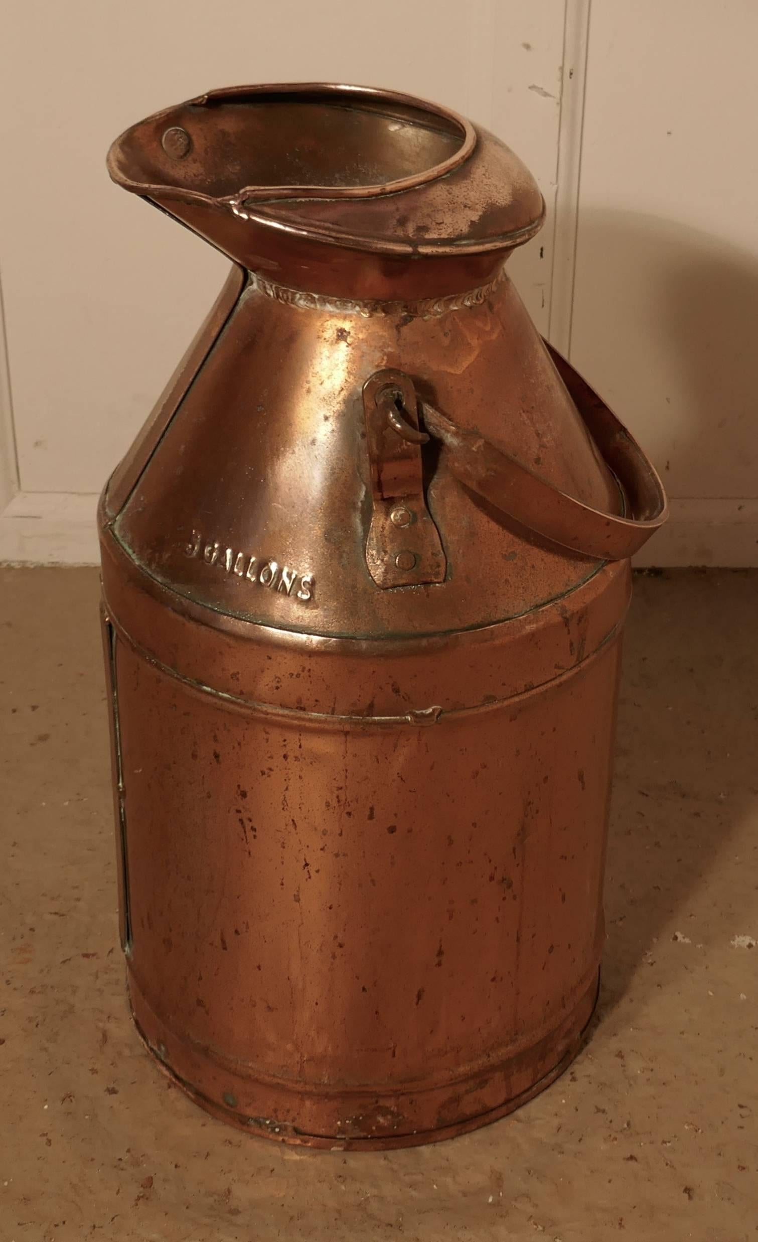 A quirky umbrella stand, copper milk churn or pail, Industrial antiques.

A handsome and quirky thing, a lovely 19th century five gallon coper milk churn with carrying handle and pouring spout, the churn is a good height for standing walking