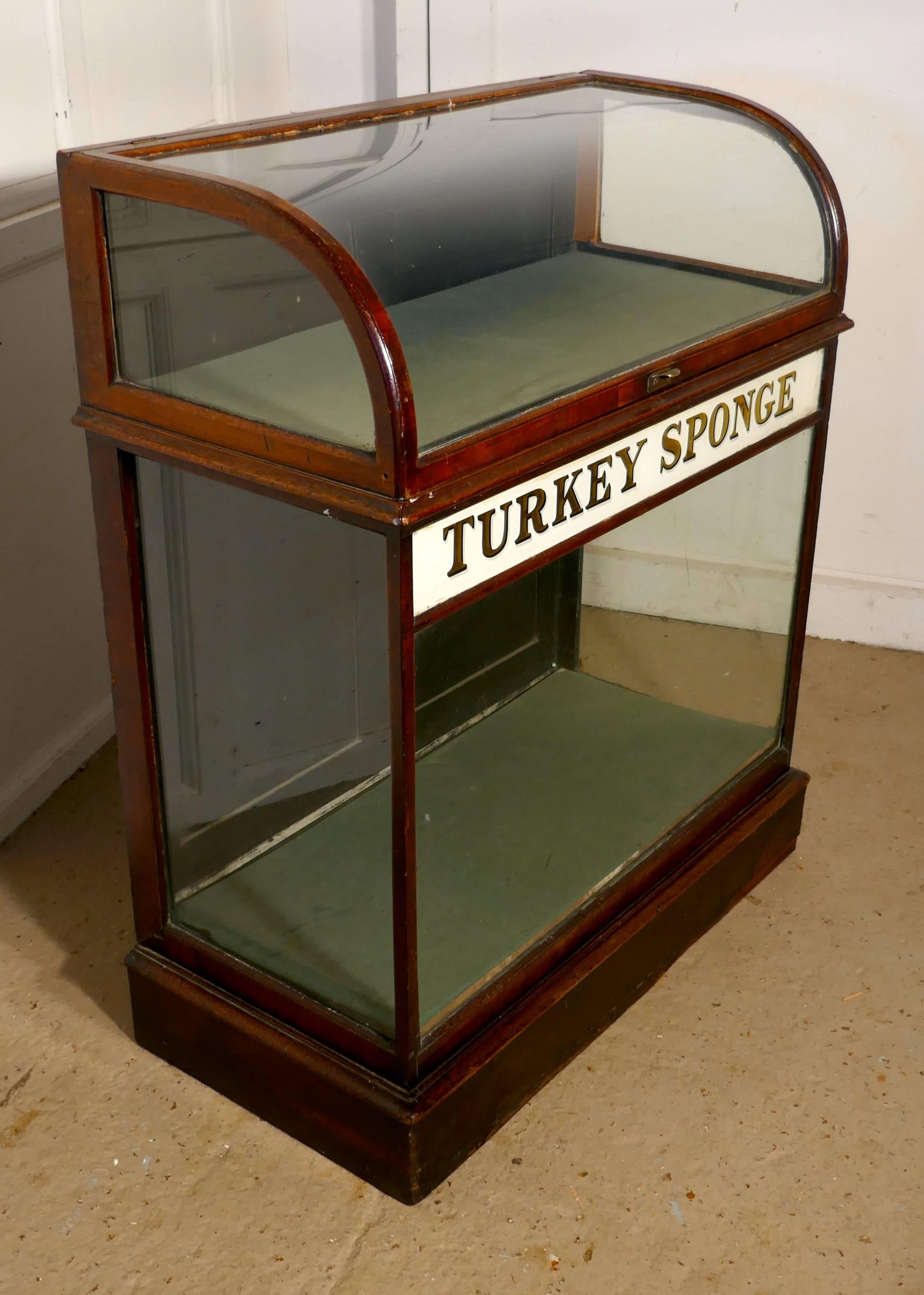 Pharmacy Shop Display Cabinet, Turkey Sponge 

This charming Victorian shop display cabinet is made in plate glass, the top section has a “D” shaped curved glass, which opens up wards, this sits over a larger display area which has mirrored gold