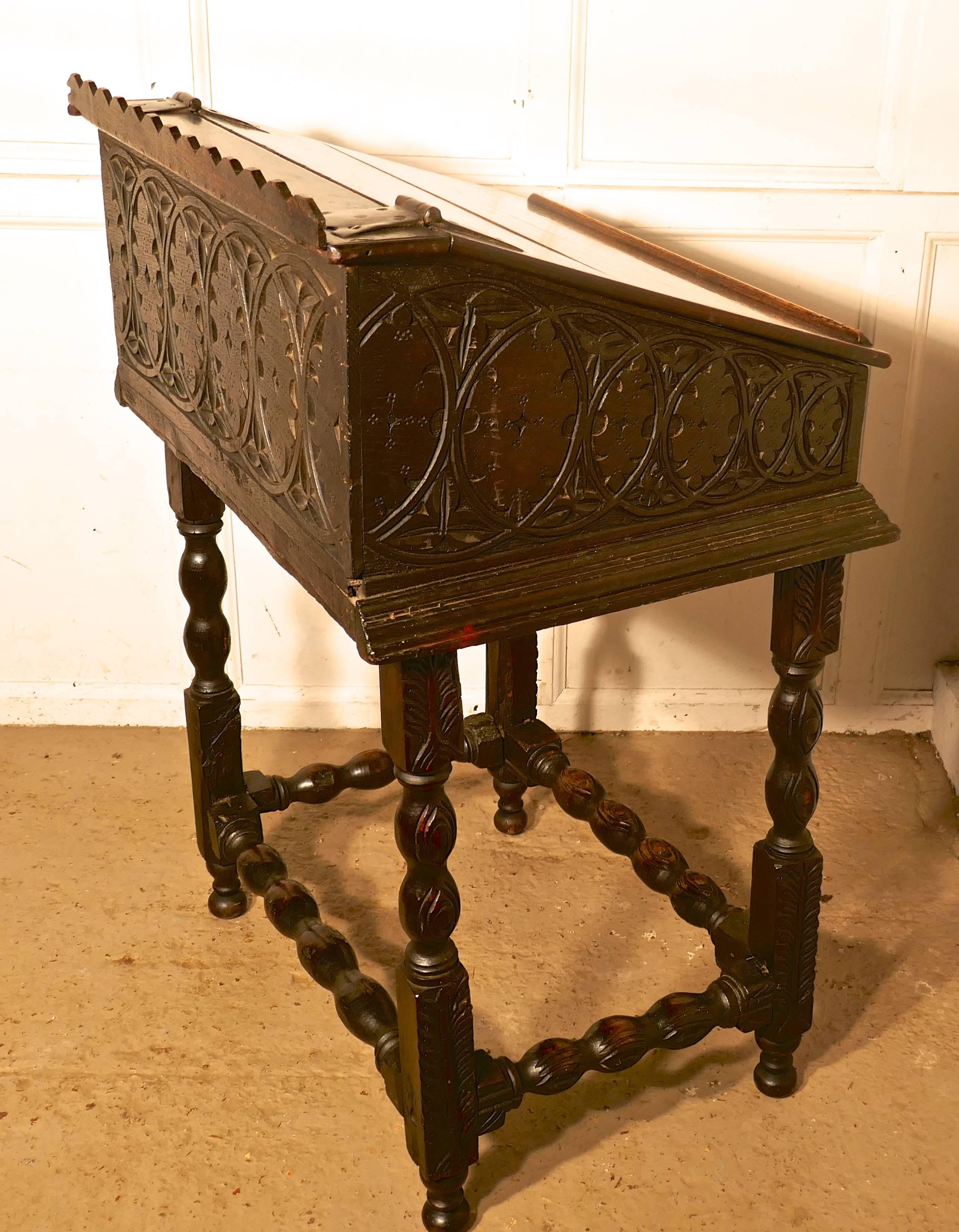 17th century carved oak Bible box reading slope desk on stand


This is a lovely old Bible box, the desk is in two pieces, the top section would have been for keeping the family bible in. With the lid closed, it can be used as a reading stand or