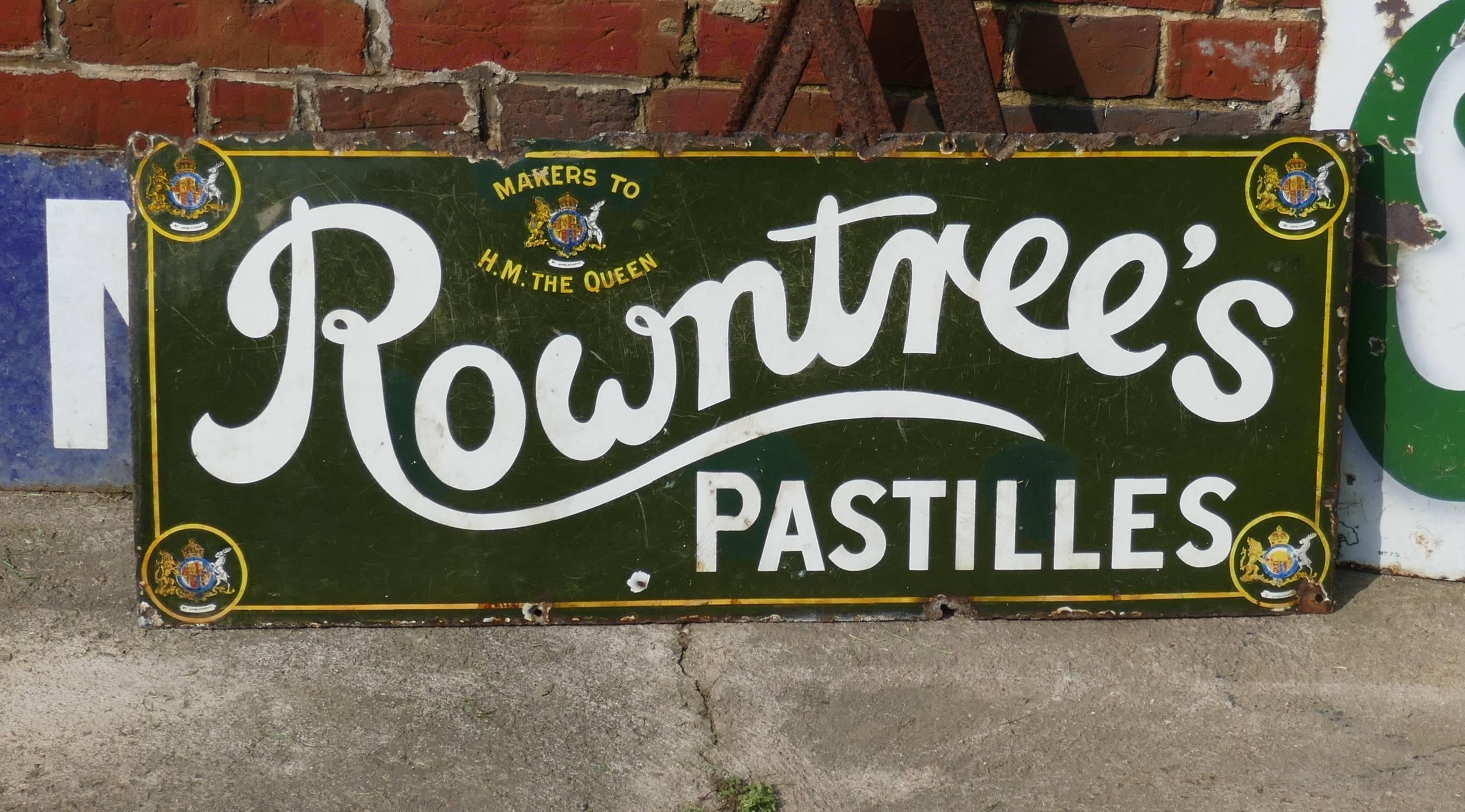 Original Rowntree's Pastilles enamel sign 

Very rare old sign, dark green background picked out with a yellow border and showing 5 Royal Warrants 
The sign is in good general condition it is made in ceramic enamel and has some rust and chipping