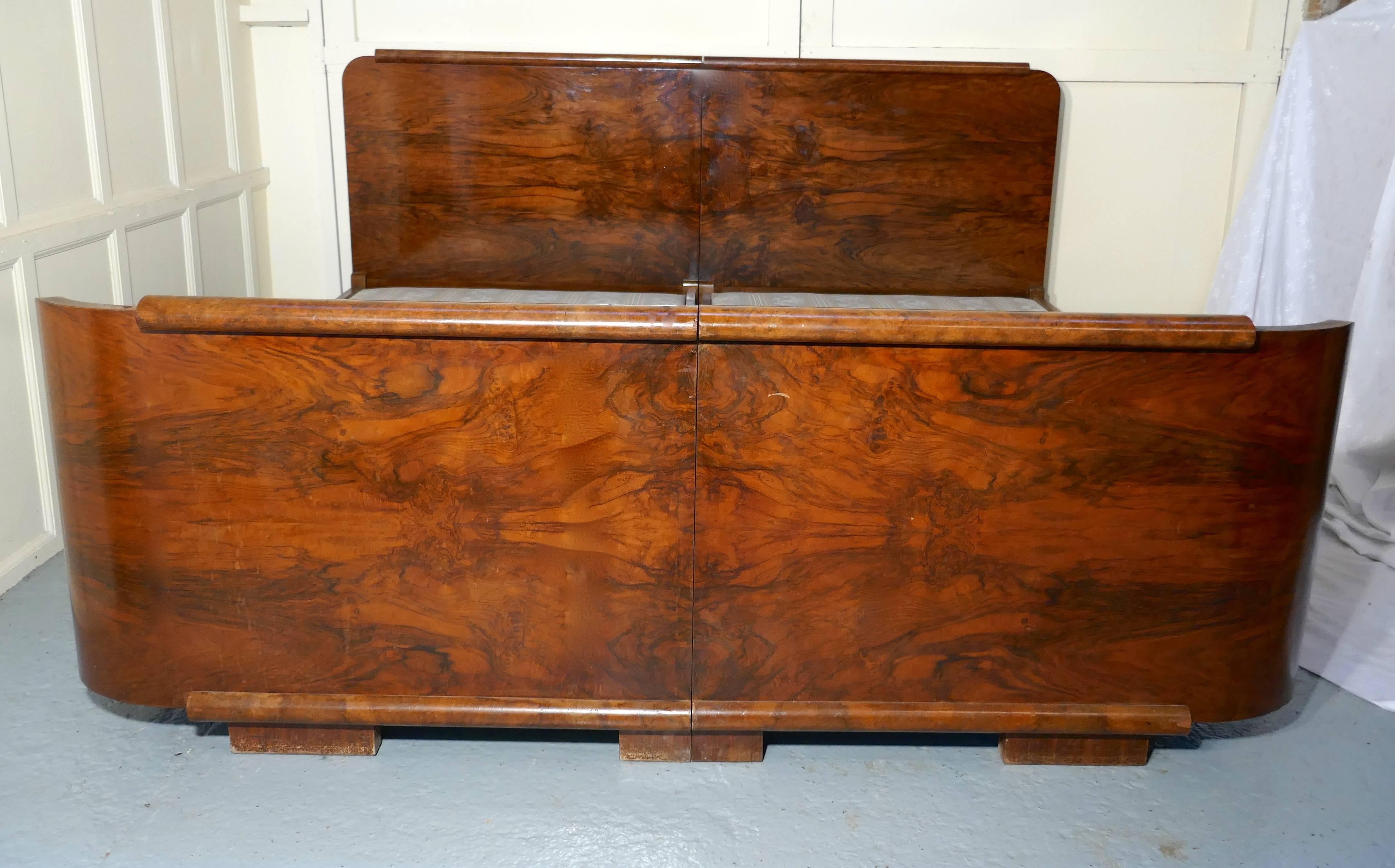 A 7-ft burr walnut Art Deco French king-size double bed or twin beds

A stunning piece of French Art Deco design, the curved foot board is veneered in burr walnut, each half mirroring the other and the high head board is mirrored in the same way,