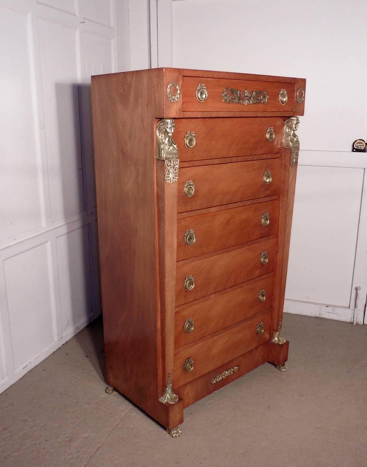 A tall French Art Deco walnut chest of drawers in the neoclassical style 
 
This is a French walnut chest, known as a seven day chest, it has seven drawers, one for each day of the week, the chest is adorned wth fine Ormolu decoration 
The chest