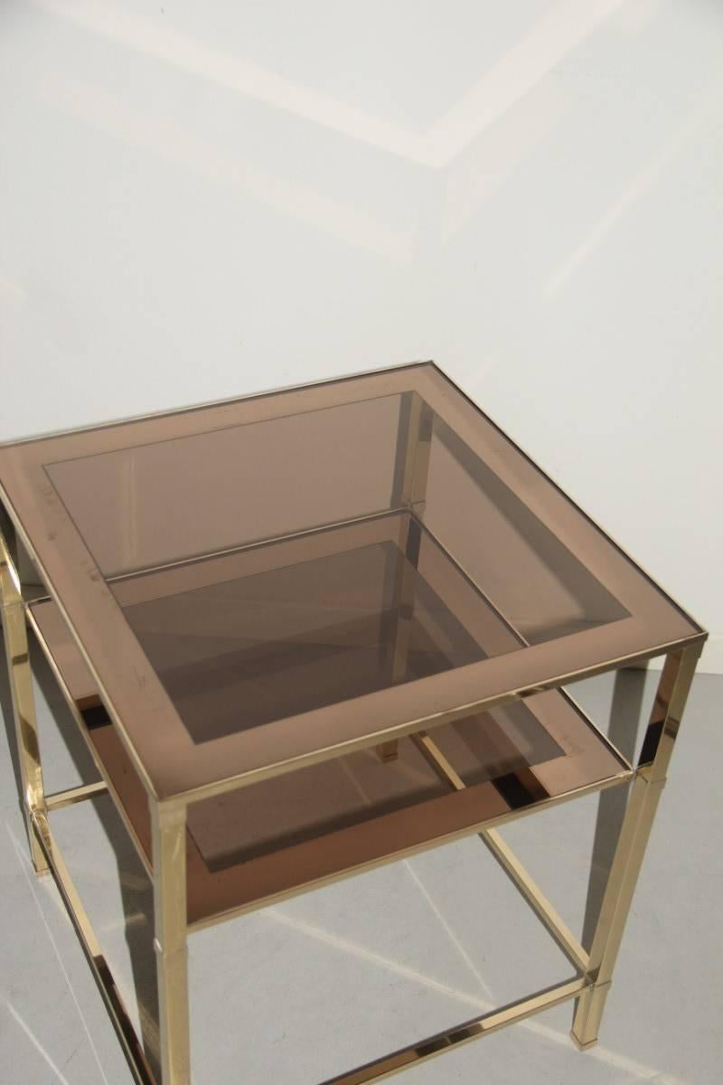 Coffee table 1970s brass and mirrored glass.