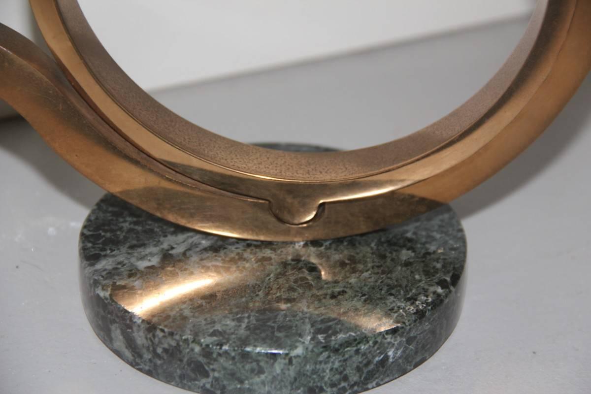 Sculpture by Virginio Ferrari 1983, brass and marble.