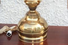 Triptych of Brass Lamps with Thatched Dome