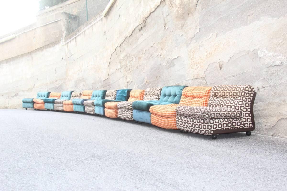Modular large sofa with 13 armchairs B&B, Italy, Mario Bellini multicolor, resin shell and multicolored fabric, are then used as such for wear tracks like some scratches and fabrics used.