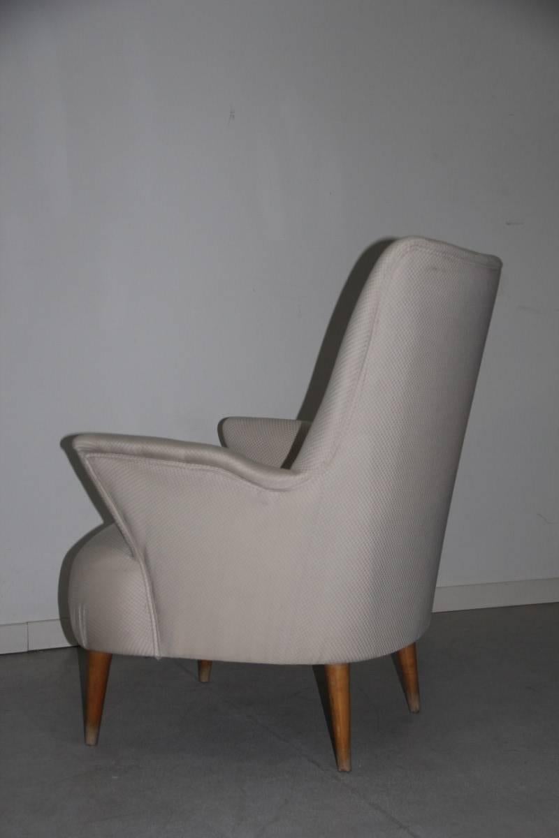 Italian armchairs in 1950s design minimal and geometric shape feat wood.