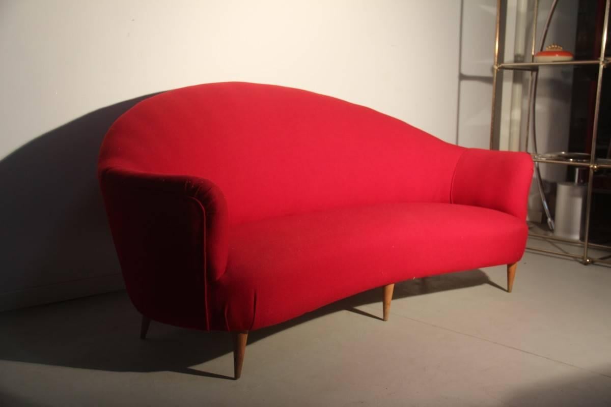 Mid-century red curved sofa 1950s Italian design wood feet, restored.