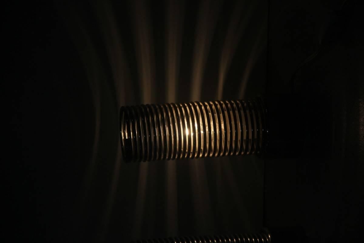 Lampes de table en forme de ressort Guzzini Harvey 1970 spirale en acier.
Étiquette signée.