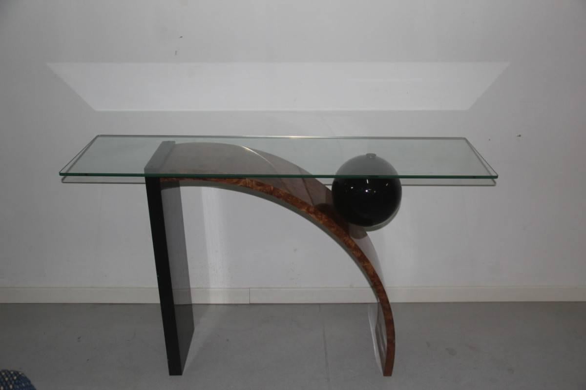 Minimal Italian consolle, 1980s, Pierre Cardin attributed.

Glass Often Top, Very particular shape and of great prestige and design.

Wood Lacquered Black Color , Walnut Root.
