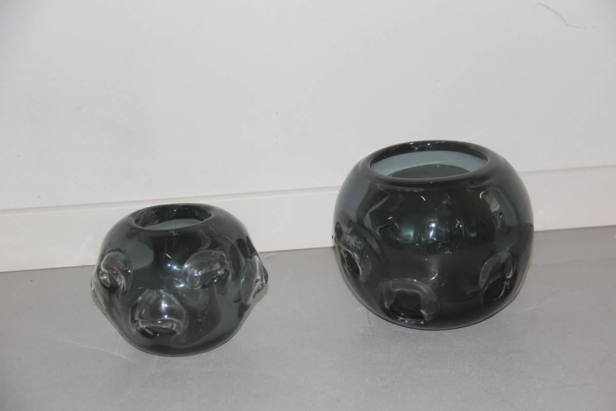 Pair vases murano glass 1960 ashlar massive, particular machining with bubbles, attributed the manufacture of Seguso, 1960.
Measures: Great height cm.16.5 diameter 19 cm,
small diameter cm 13 height cm 17.