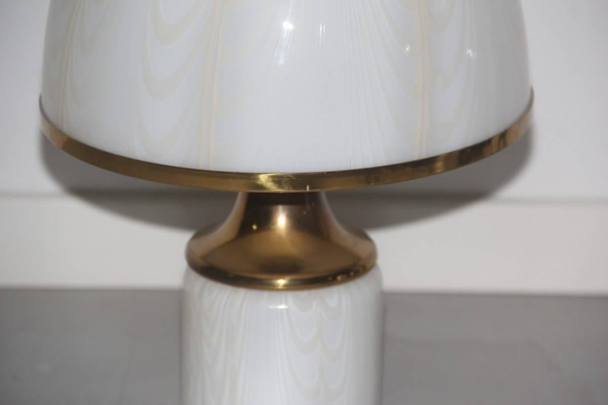 Particular table lamp brass and glass Murano 1970s, as can be seen the glass processing is very special.