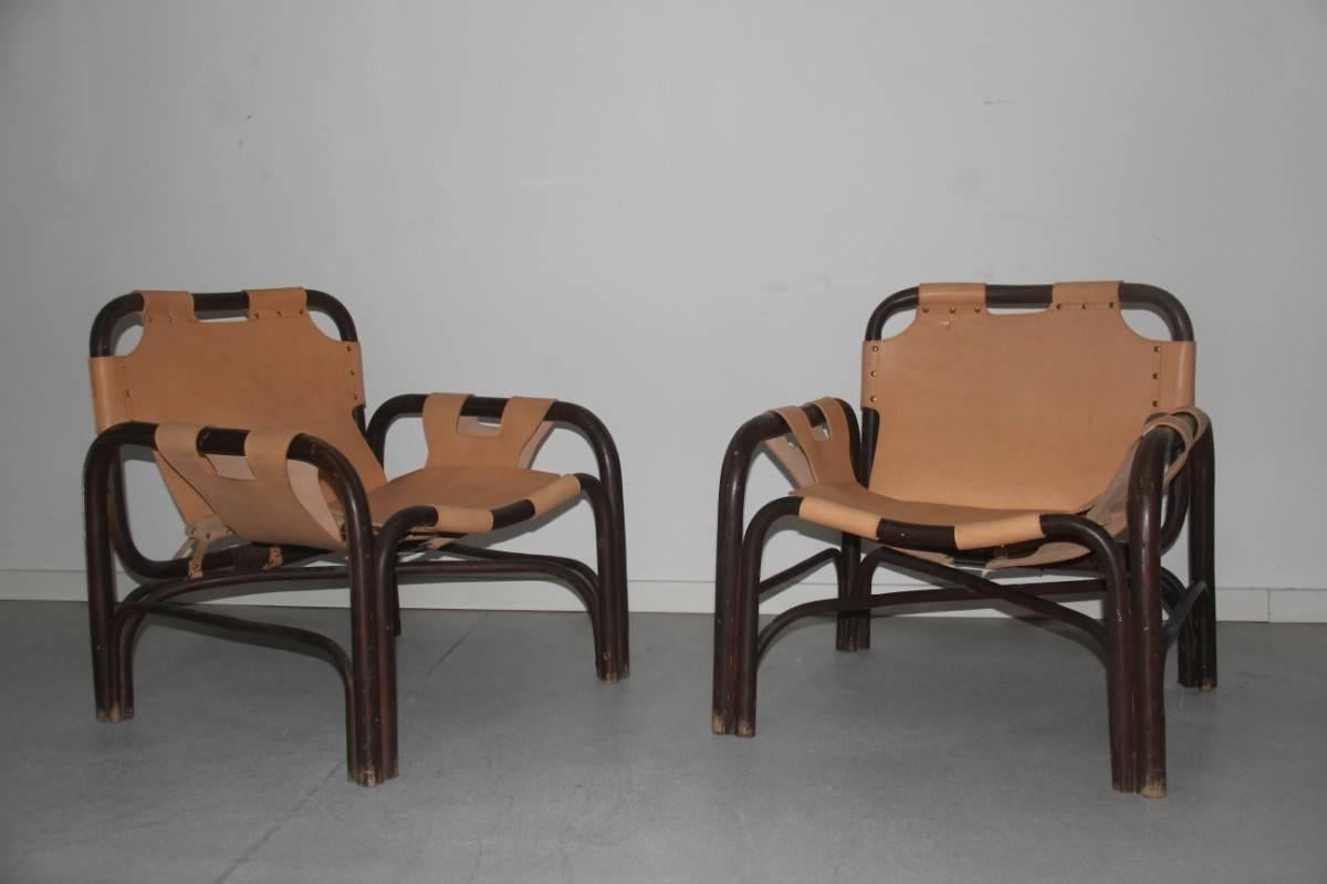 Couple Leather armchairs and Rattan Bonacina Attributed Tito Agnoli, We replaced the dogs because they were very ruined and broken, so we preferred to make them 100% useful, bamboo structure perfectly integrates.