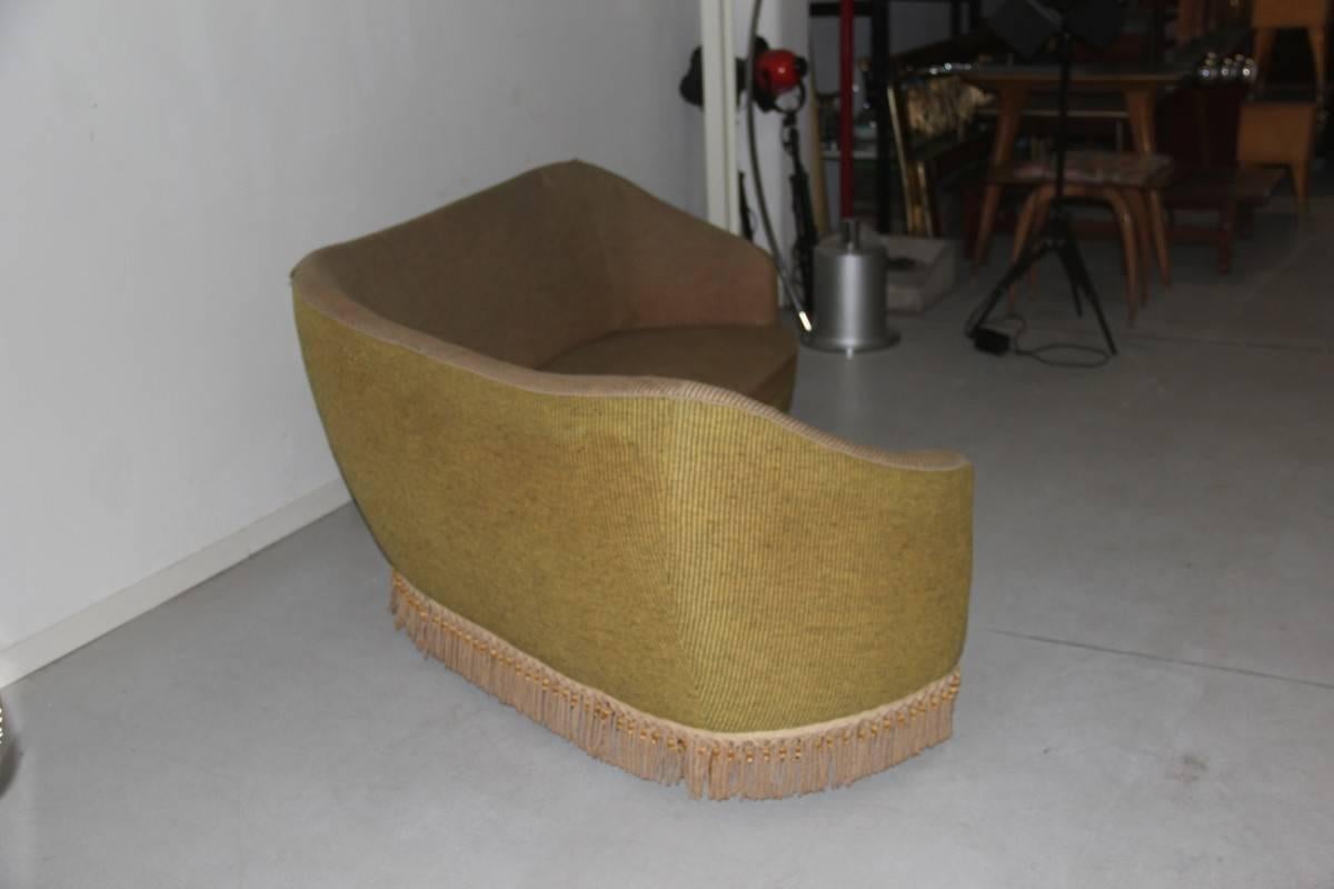 Wonderful 1950 Italian curved sofa Boomerang, In velvet and fringe, the state is original with stains on the fabric.