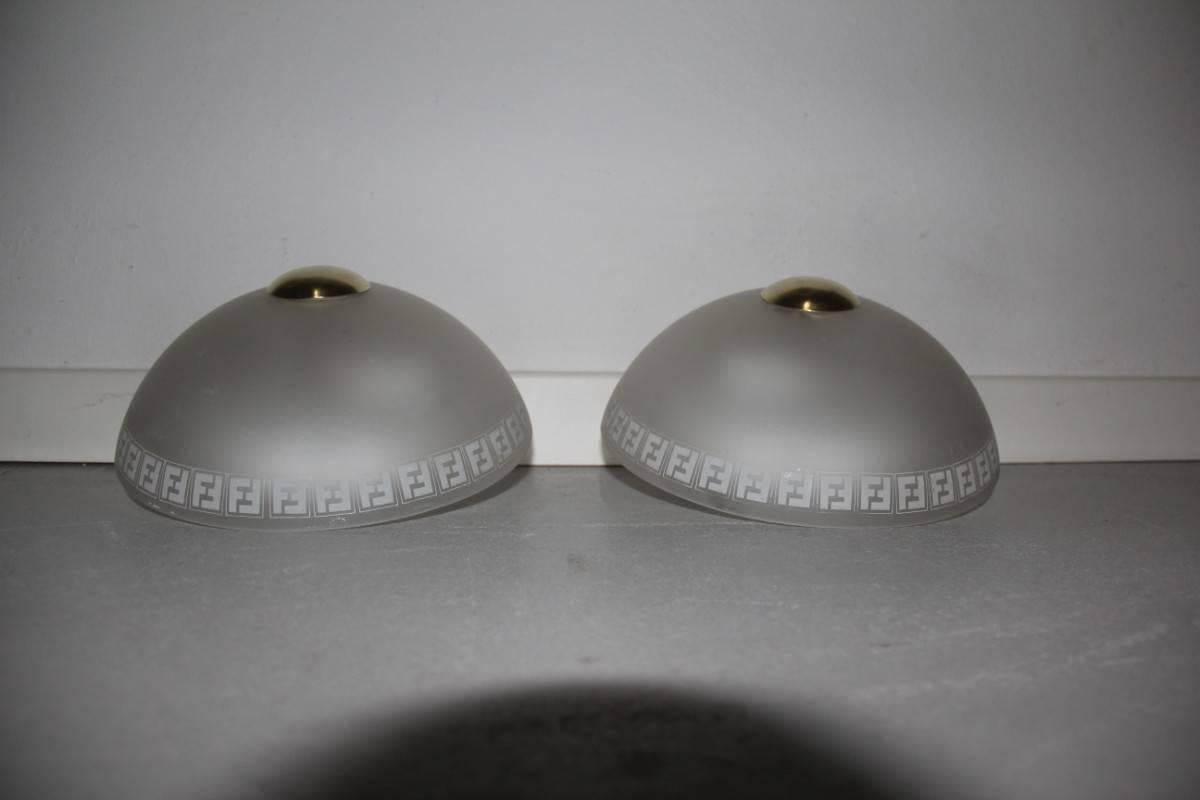Elegant and Chic pair sconces Fendi design 1970, Satin crystal and brass button.