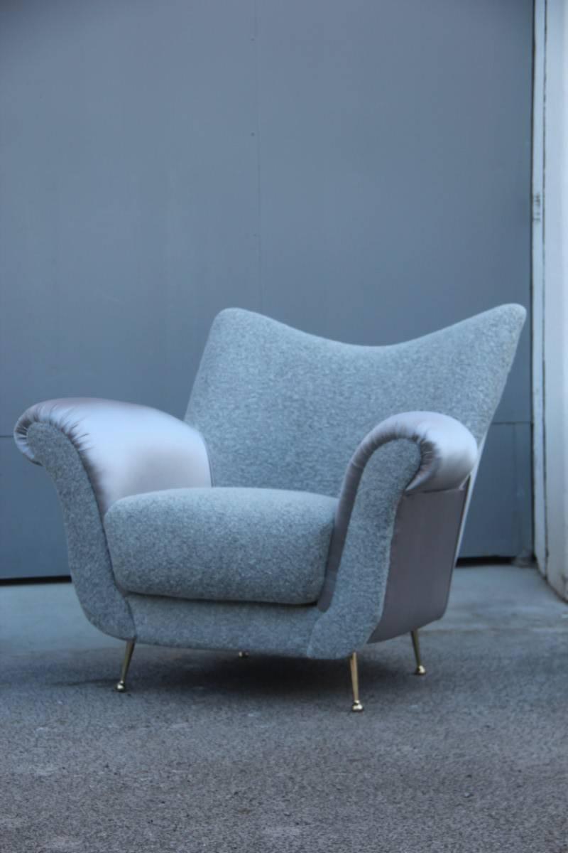 Fabulous chic and elegant mid-century Italian design armchairs, restored with silver satin fabric, and wool parts, the design and shapes are really extraordinary, brass feet are polished, armchairs for elegant and unique environments.