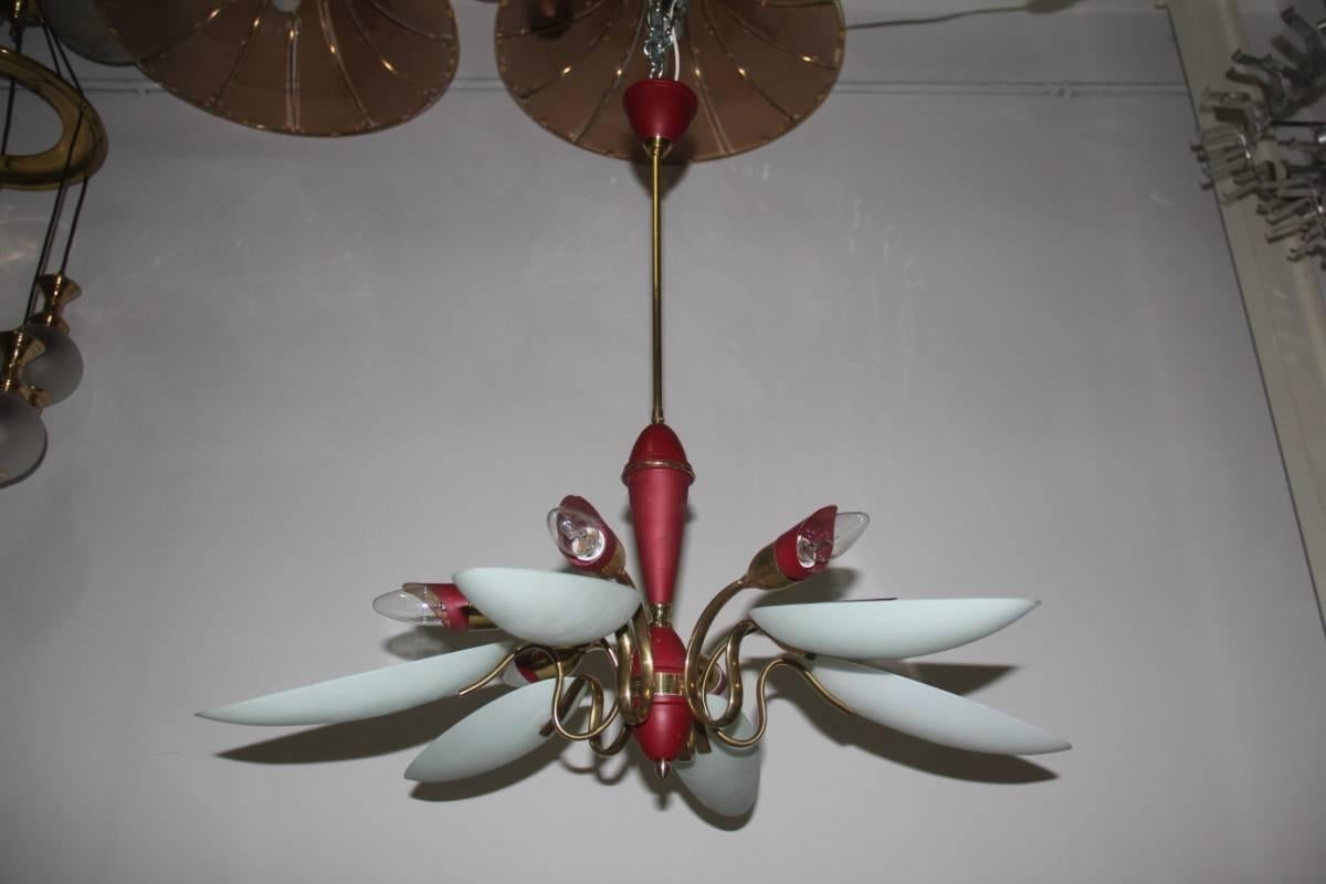Mid-century Italian design chandelier very elegant, brass structure and red colored metals, opal curved glasses.