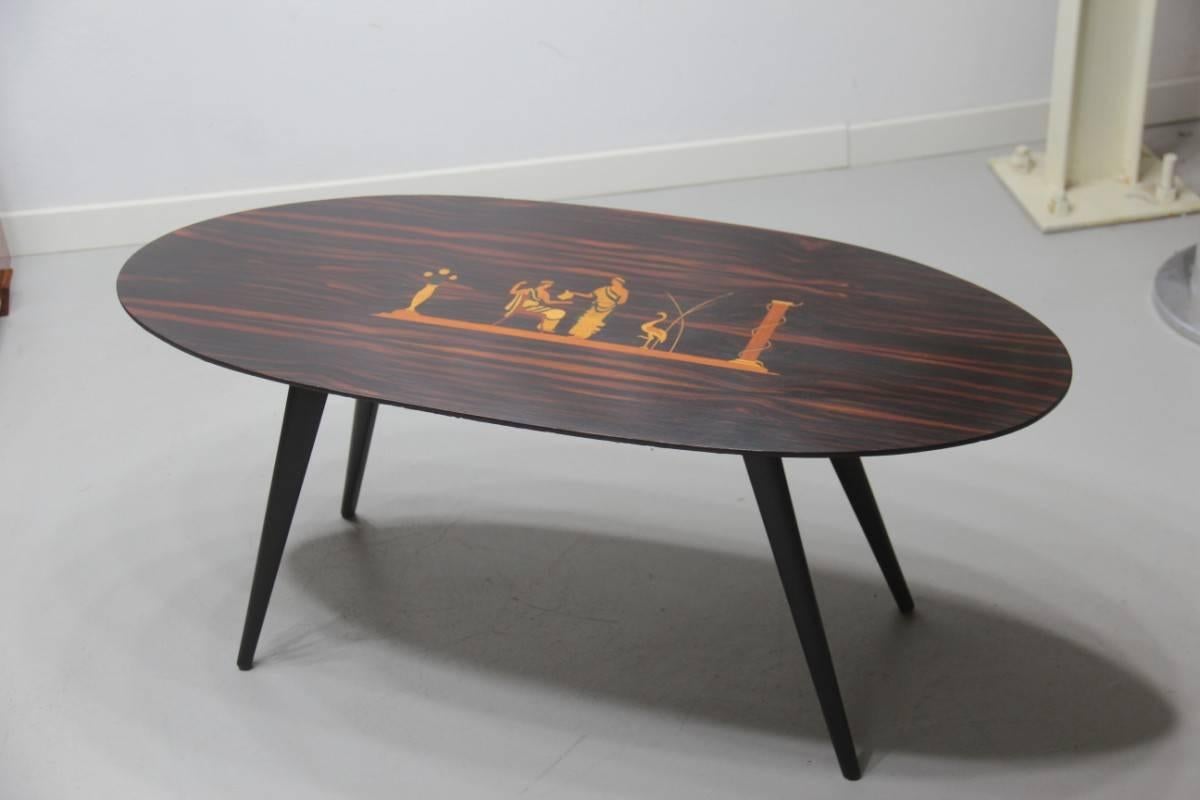 Italian mid-century table coffee oval form, rosewood and inlaid with precious woods.