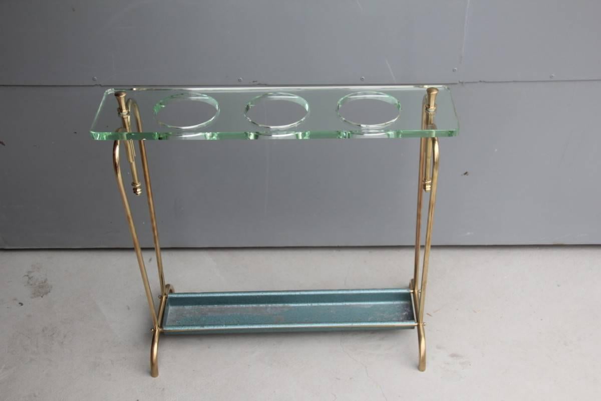 Elegant and refined umbrella holder crystal art 1950s, Italian design, made of brass that has been polished, and a thick glass plate with umbrella holes, unique design and very particular, minimal elegant and prestigious object.