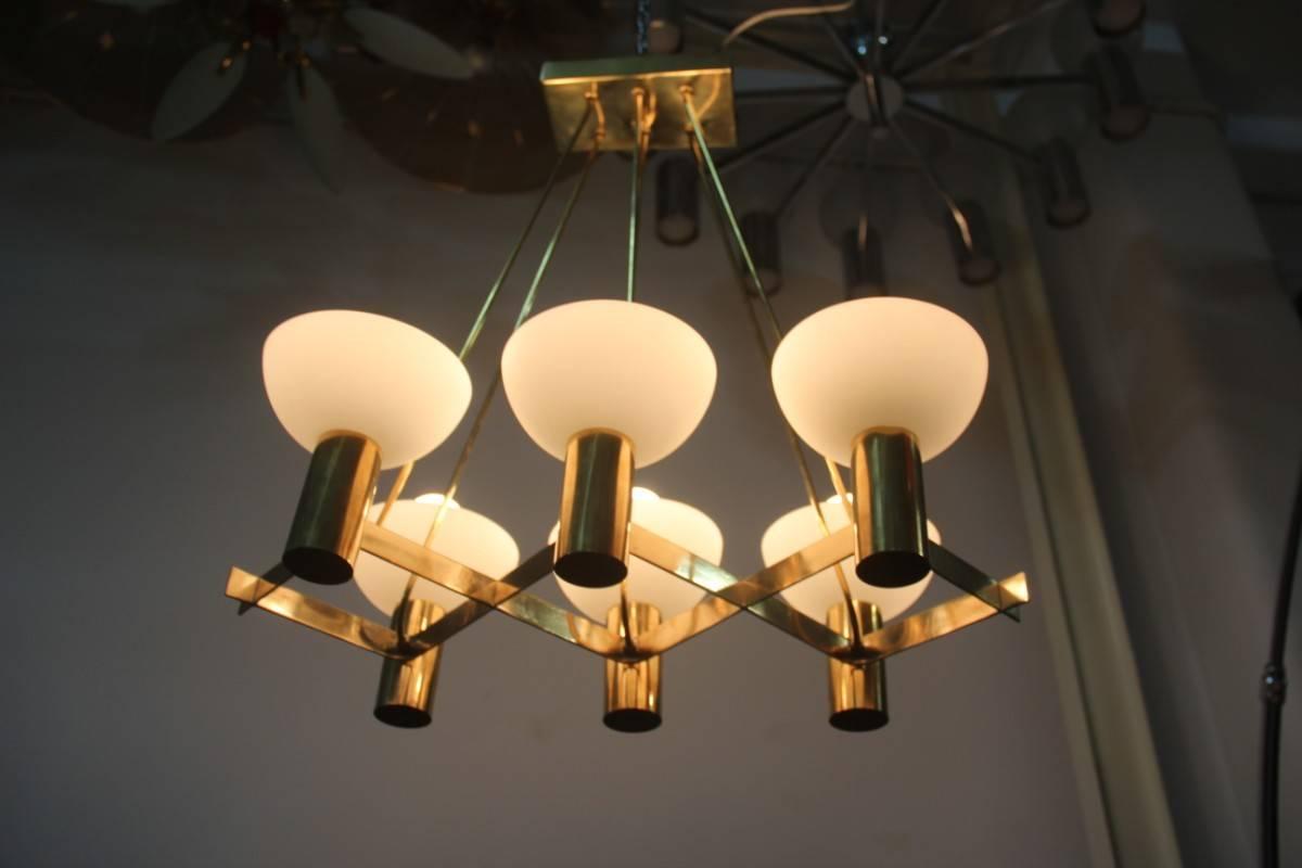 Midcentury Italian chandelier elegant and chic, brass structure semi-glazed glass opal glasses, Minimalist and sculptural shapes, great design, in the style of Stilnovo manufacture.