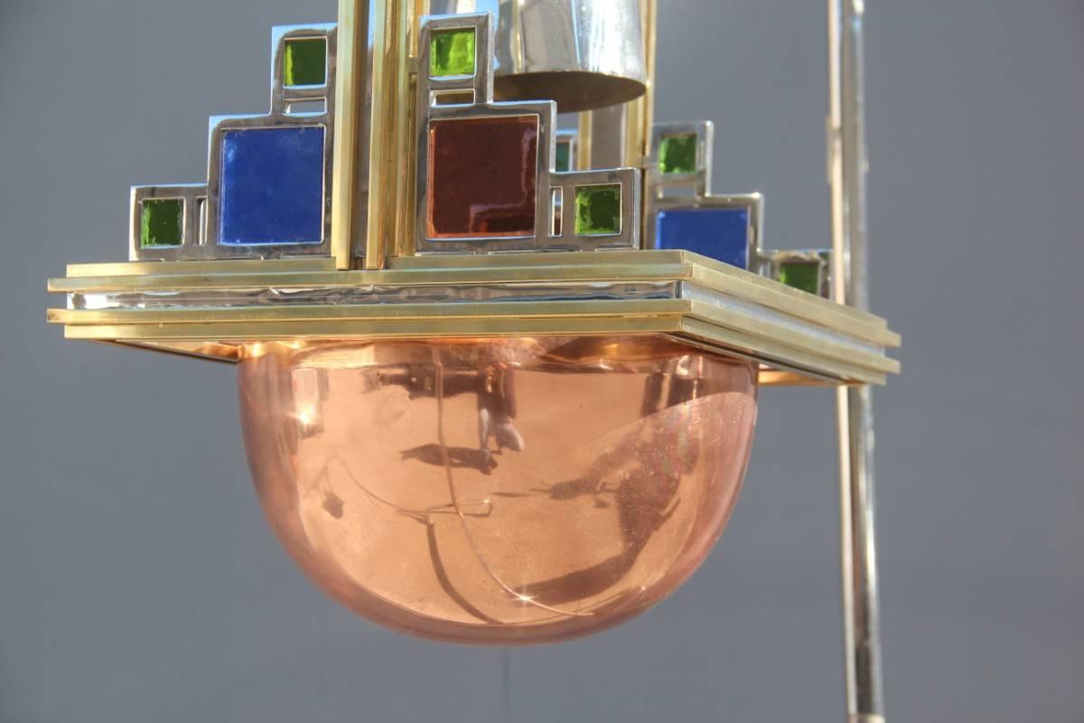 Particular ceiling lamp Romeo Rega design made in Italy,made from ferrous materials such as brass, copper and chromed metal. Colorful glasses, very elegant and refined.