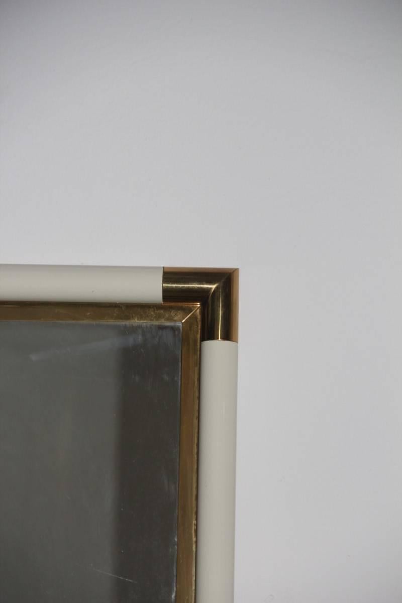 Lacquered metal and brass Italian Particular console with mirror, mirror cm.100 x 65.
