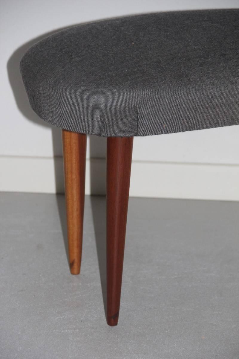 Midcentury Italian design very particular shape stool, feet of mahogany wood.