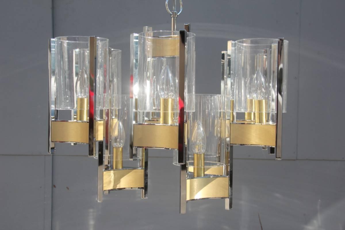 Sciolari minimal sculptural chandelier brass and glass.
Nine lights, small attack E14.