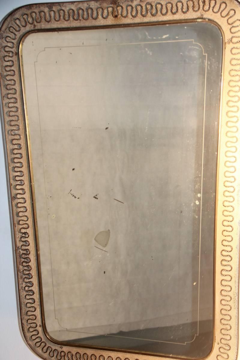 Italian Mid-Century mirror brass and perforated metal, 1950s. Original condition.