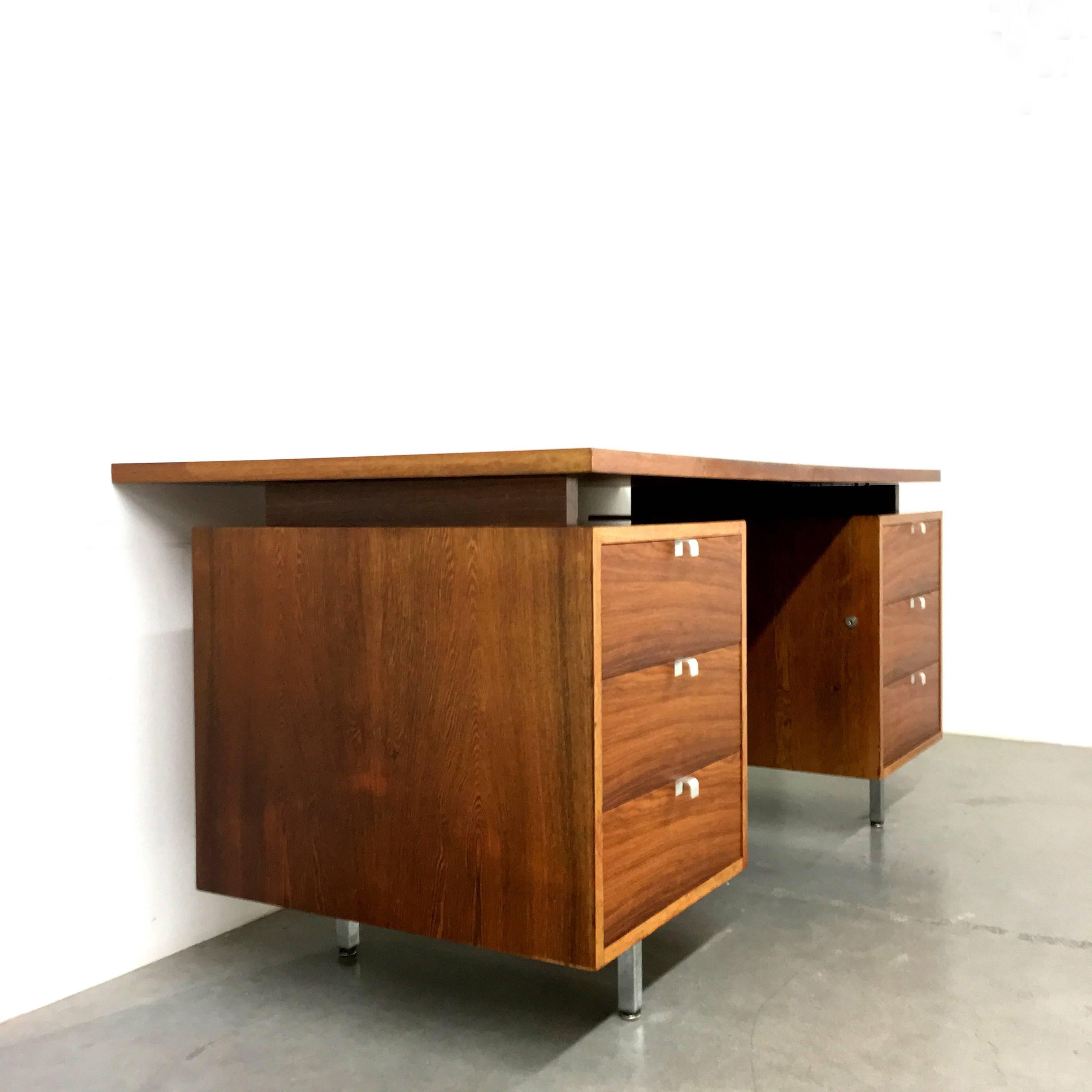 Executive desk, designed in 1960 by George Nelson, manufactured by Herman Miller. Plain-functional design, for that reason extremely beautiful!
The table is made of rosewood. The top is high gloss varnished, the drawer boxes are semi-mat.